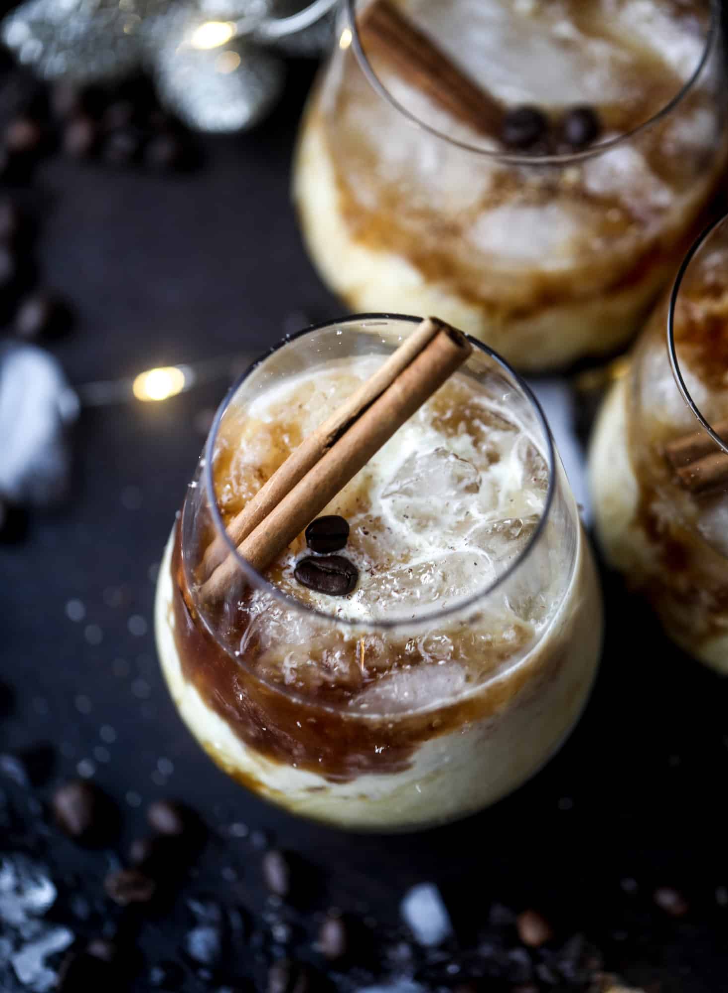 The eggnog white russian cocktail is perfect for the holiday season! Coffee liqueur mixed with vanilla vodka and eggnog and topped with freshly grated nutmeg is the perfect treat and oh-so festive! I howsweeteats.com #eggnog #whiterussian