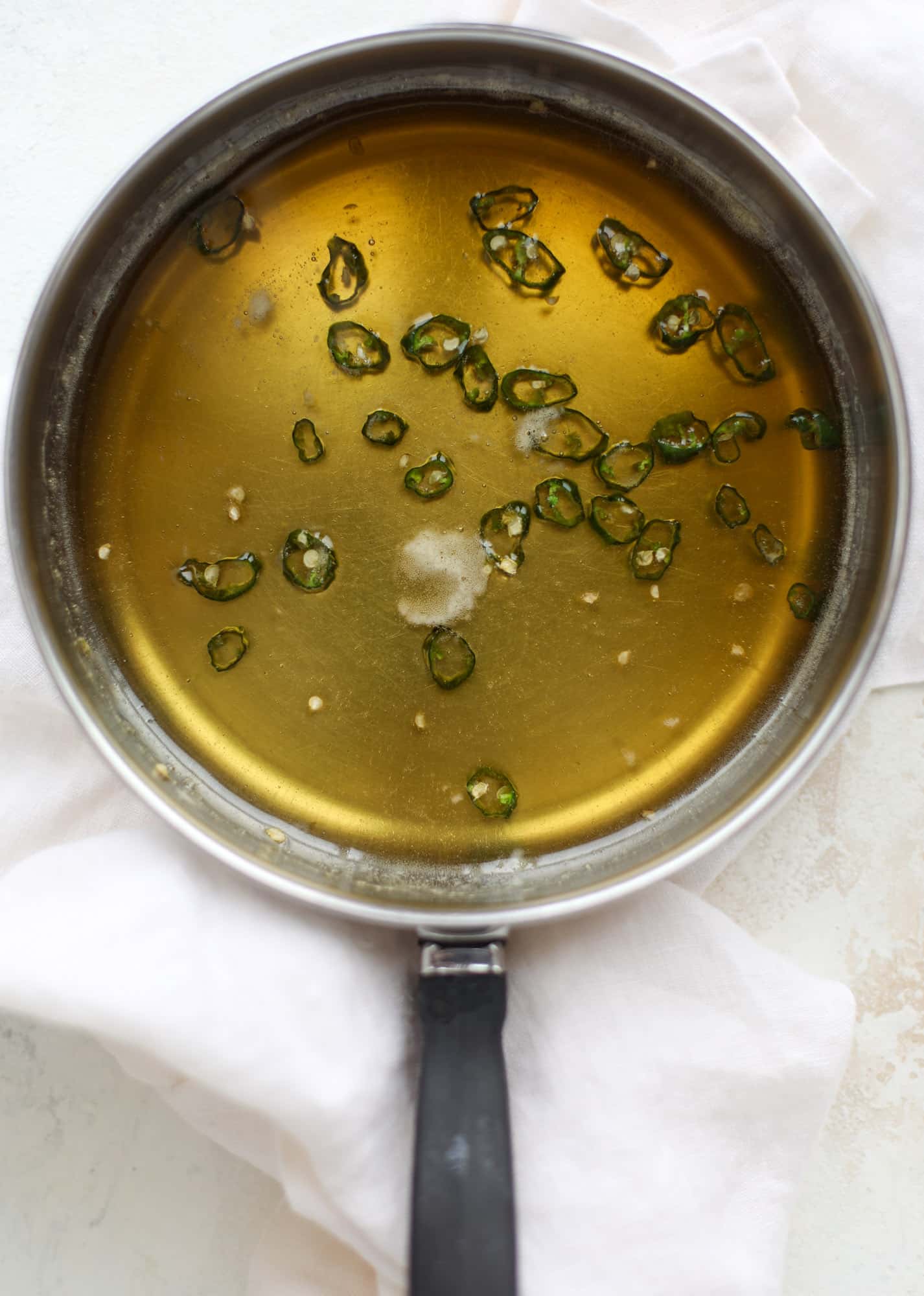 This hot honey salmon is flakey and buttery with a hint of heat and a sprtiz of lemon. It's an easy weeknight meal and is delicious on salads for lunch! I howsweeteats.com #hothoney #salmon