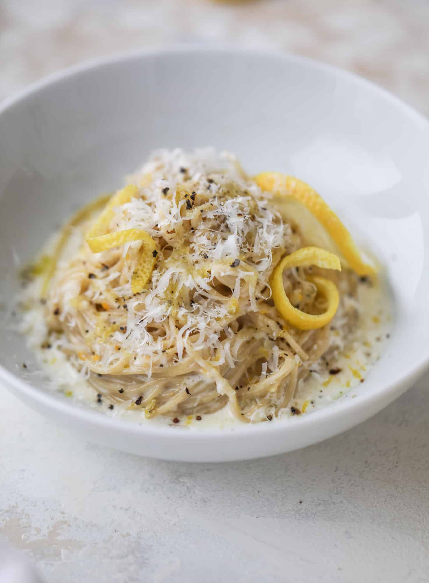 This cozy lemon pasta is light, refreshing and perfect for dinner when paired with a simple greens salad. It comes together in 20 minutes! I howsweeteats.com #lemon #pasta