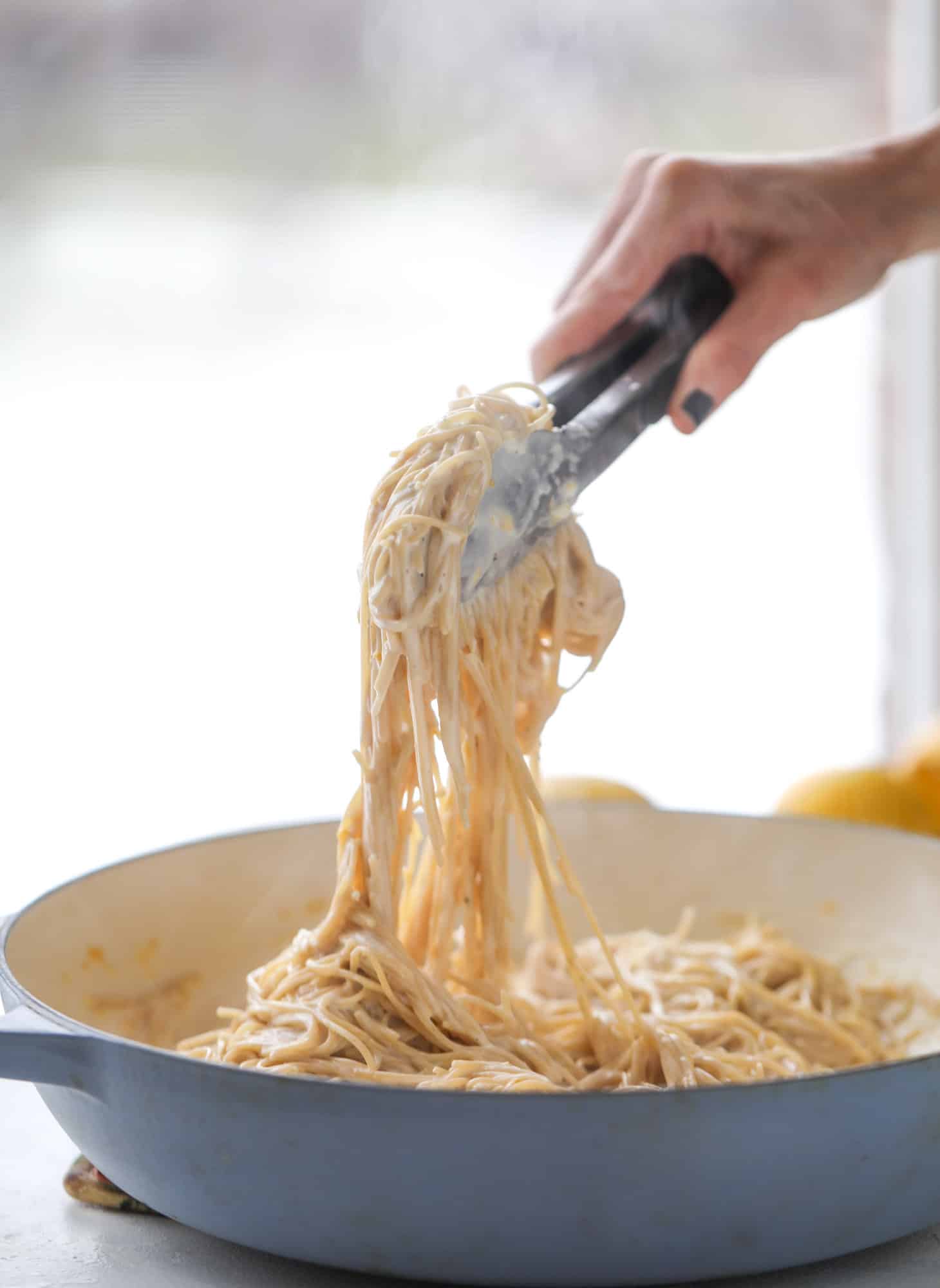 This cozy lemon pasta is light, refreshing and perfect for dinner when paired with a simple greens salad. It comes together in 20 minutes! I howsweeteats.com #lemon #pasta