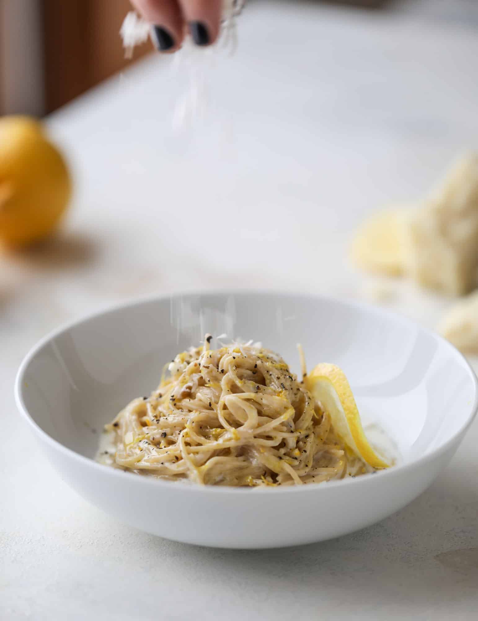 This cozy lemon pasta is light, refreshing and perfect for dinner when paired with a simple greens salad. It comes together in 20 minutes! I howsweeteats.com #lemon #pasta