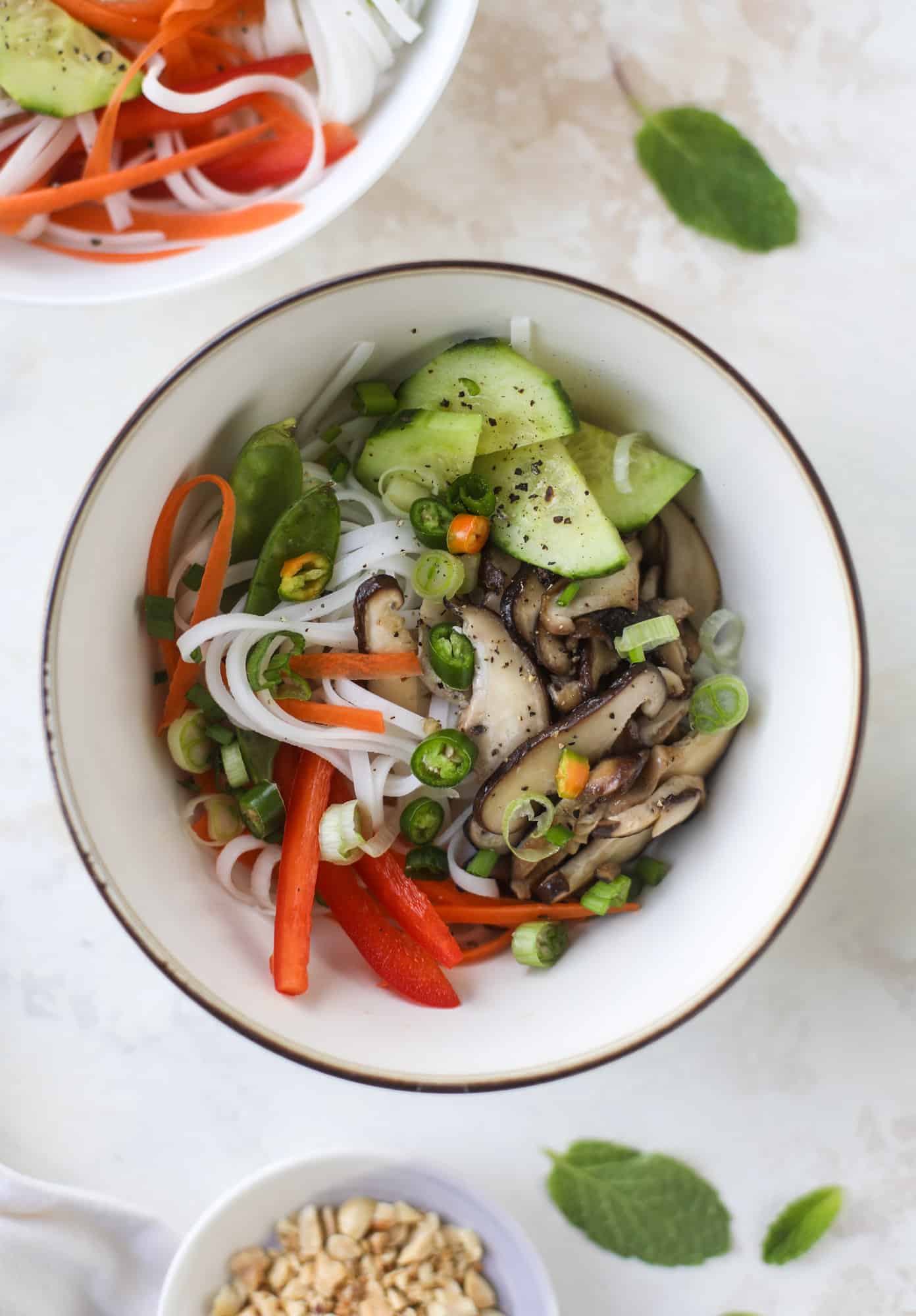 Ginger scallion noodle bowls are a flavorful, comforting vegetarian meal that can be customized to include any veggies you love! I howsweeteats.com #noodle #bowls