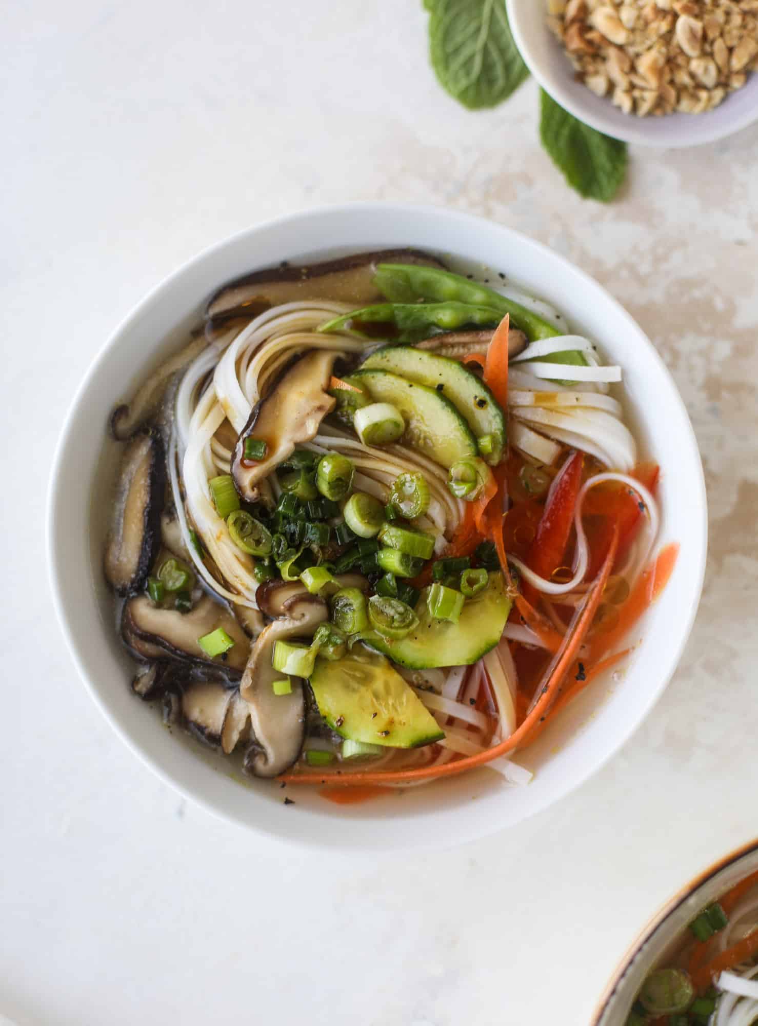 Ginger scallion noodle bowls are a flavorful, comforting vegetarian meal that can be customized to include any veggies you love! I howsweeteats.com #noodle #bowls
