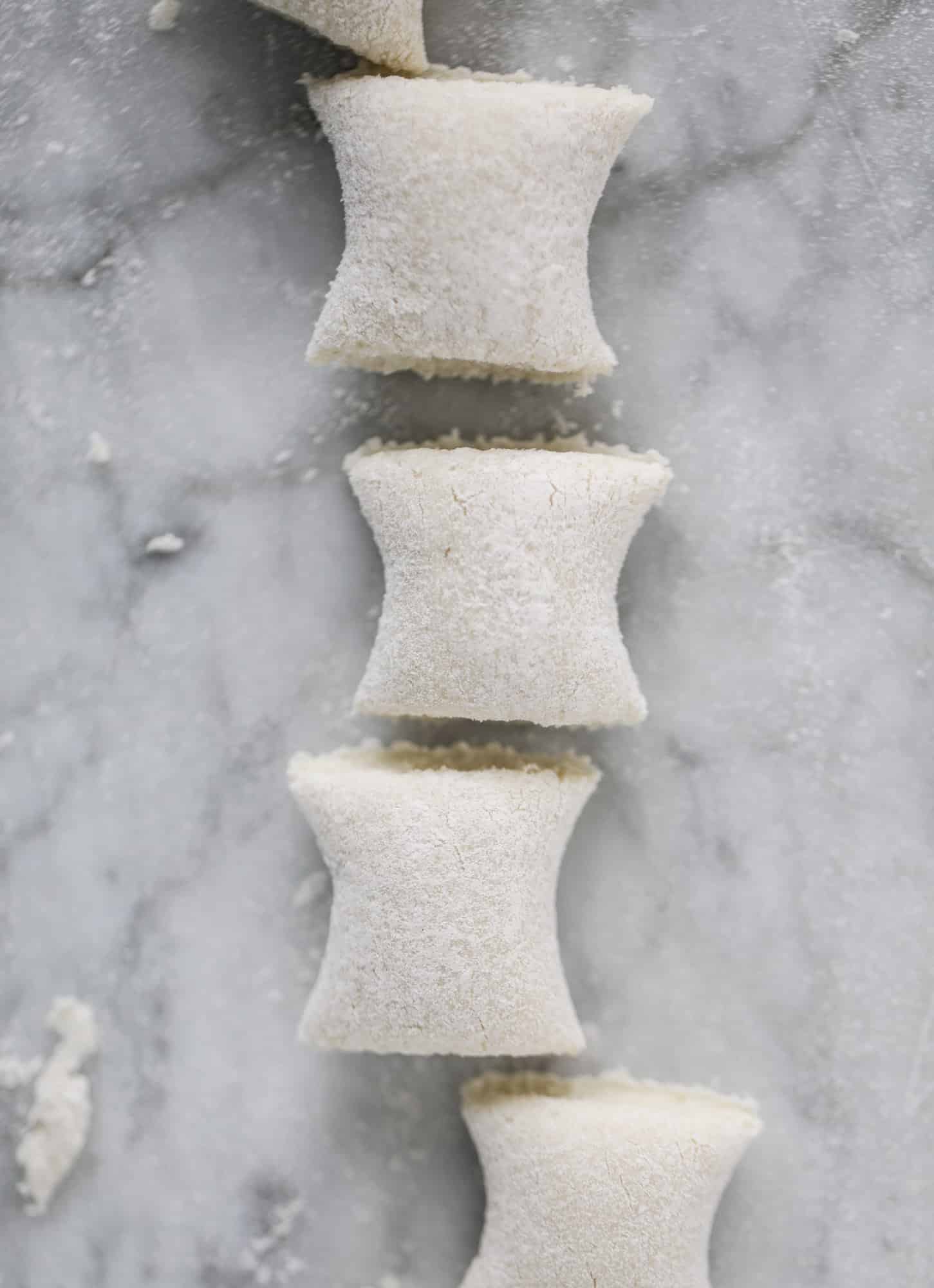 Homemade cauliflower gnocchi that tastes just like the Trader Joe's version! It's made with cauliflower, comes together fast and is super easy! I howsweeteats.com #cauliflower #gnocchi