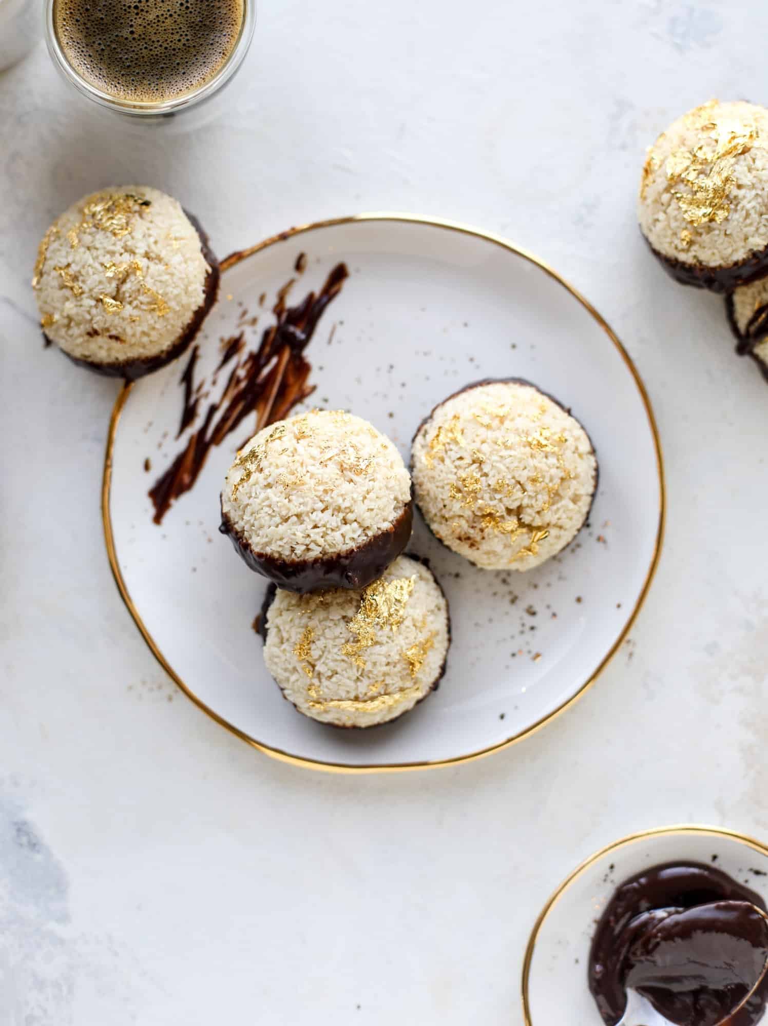 Classic chewy, slightly gooey coconut macaroons dipped in an irish cream chocolate ganache. Easy to make and gluten free too! I howsweeteats.com #irishcream #coconutmacaroons