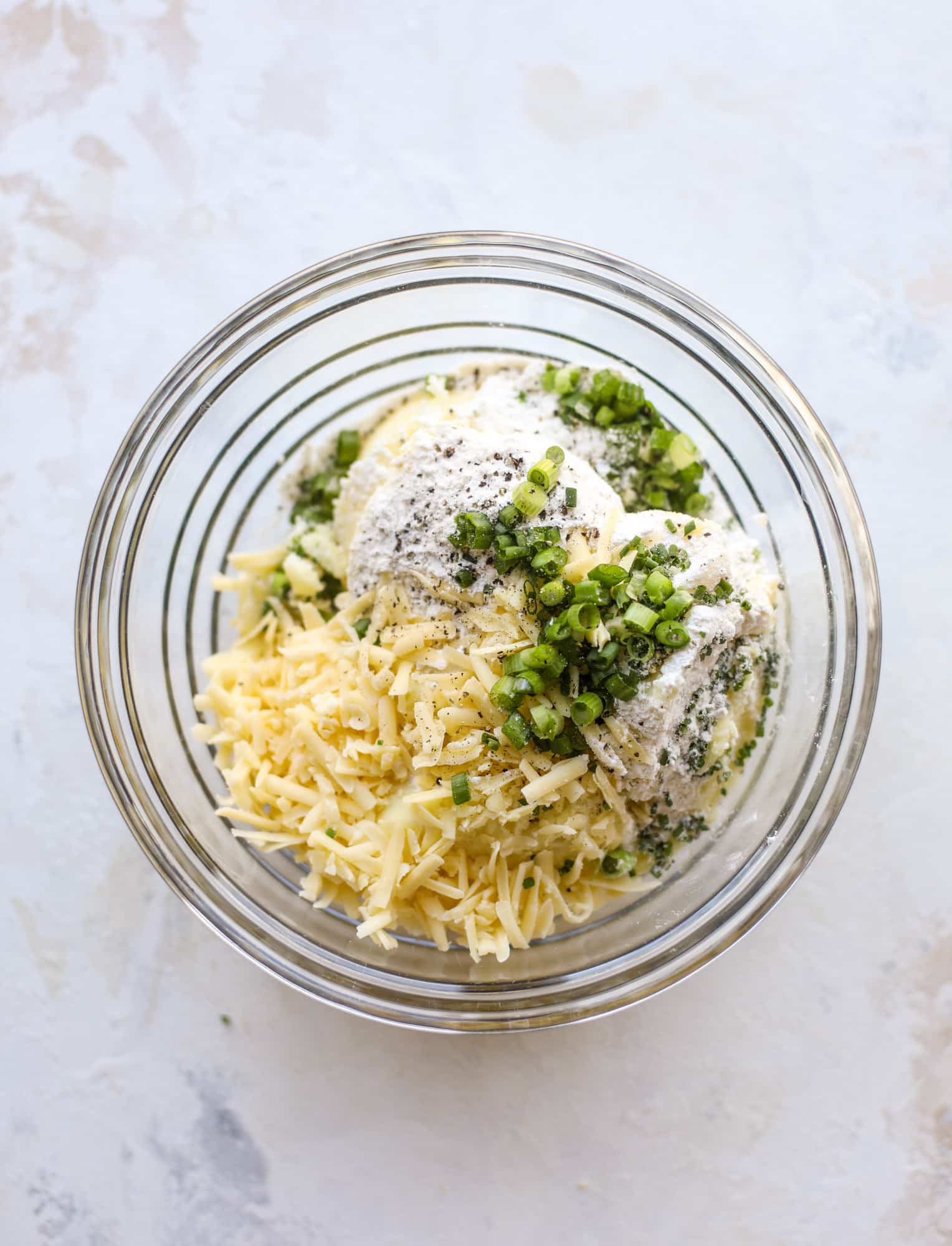 Loaded mashed potato pancakes are the perfect comfort food or side dish to a hearty meat. Crispy mashed potatoes with aged cheddar. Delicious! I howsweeteats.com #mashedpotato #pancakes