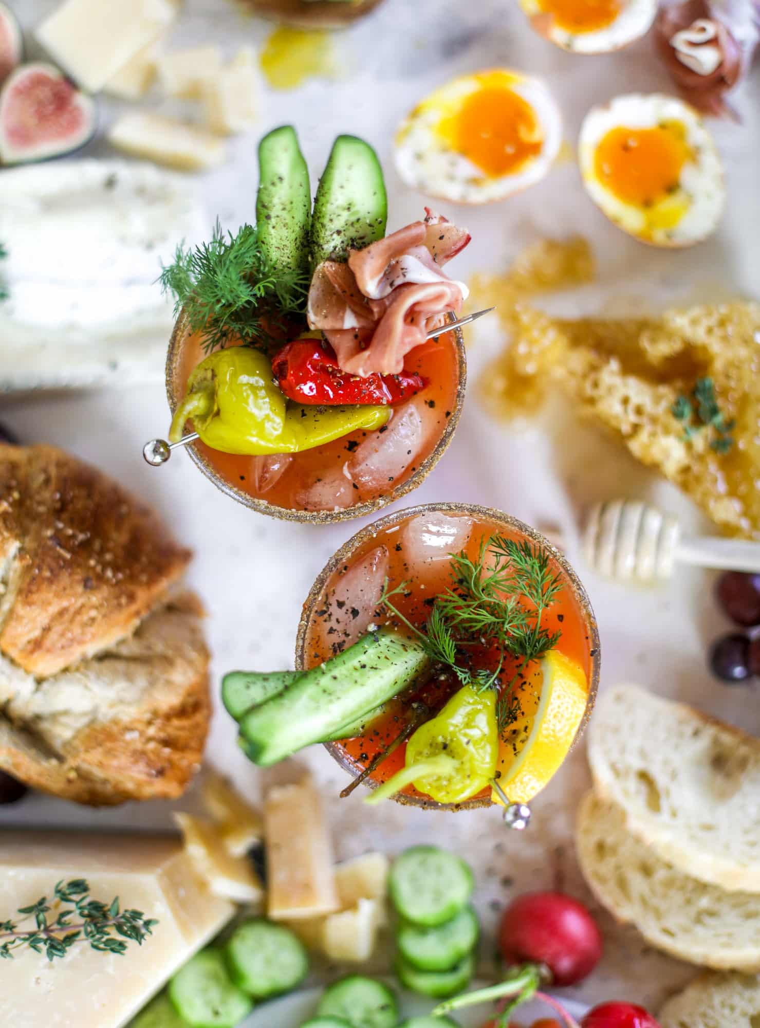 The highlight of this Easter brunch board are the deviled eggs and soft boiled eggs! Add some avocado toast, donuts and bloody marys and you've arrived. I howsweeteats.com #brunch #board