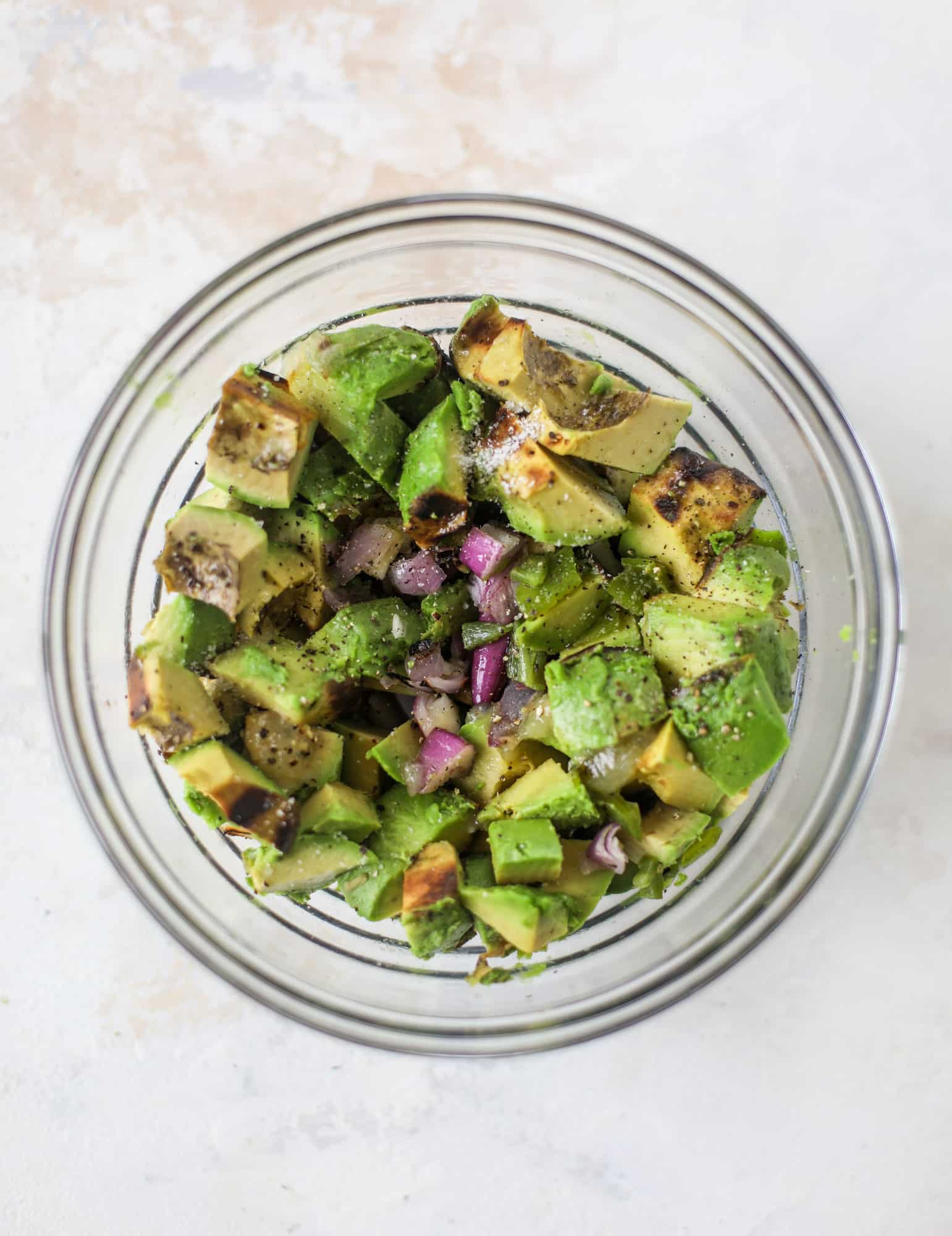 Take your guac up a notch by grilling the ingredients! This grilled guacamole is smoky and flavorful and just begging for all the chips.