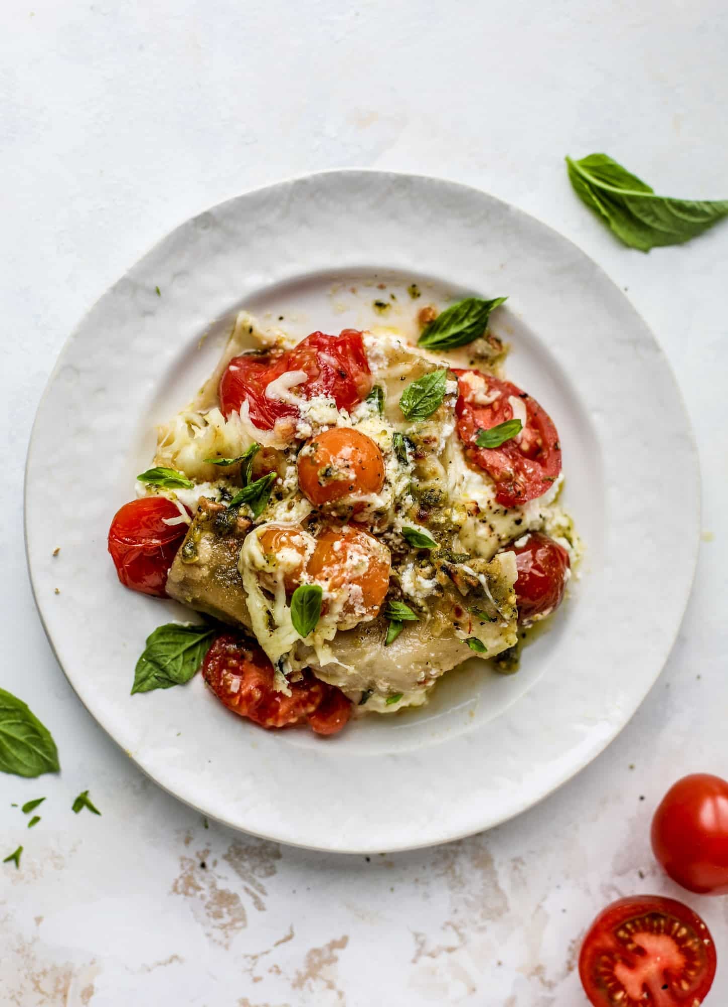 Quick caprese skillet lasagna is a lovely and comforting summer meal! Lots of fresh basil, ripe tomatoes and cheese bring this easy weeknight meal together.