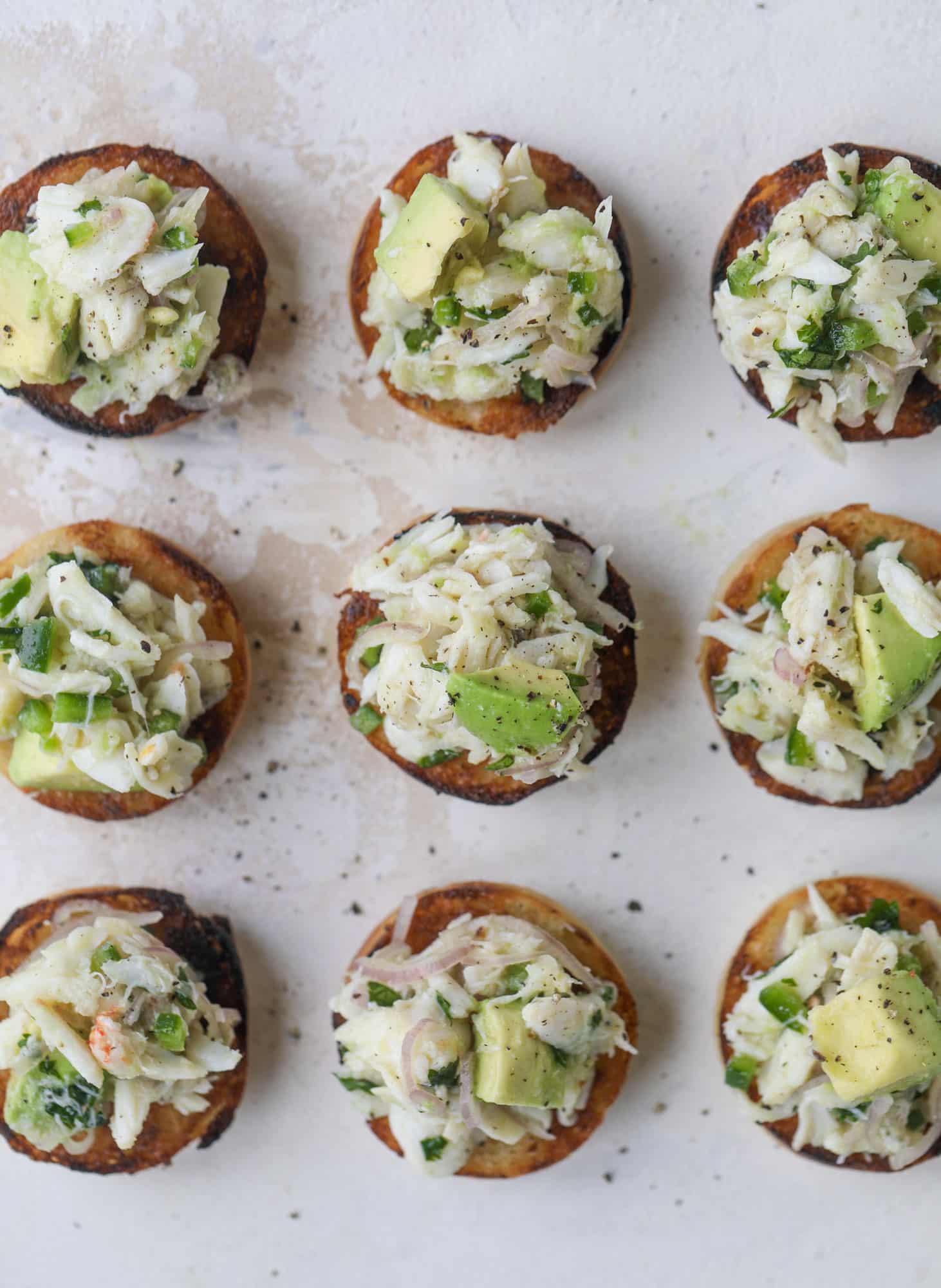 The cutest crab salad toasts are perfect for a snack, appetizer or light meal with a greens salad. This avocado crab salad is so refreshing and light!