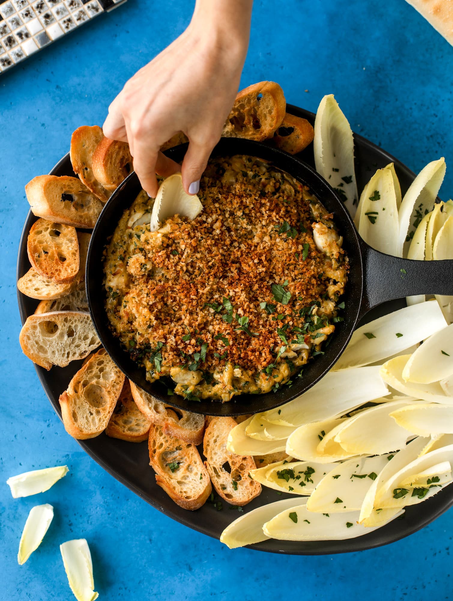 This deviled crab dip is the perfect hot summer appetizer. Lump crab, a creamy, decadent sauce, crunchy breadcrumbs and fresh endive for dipping. YES.