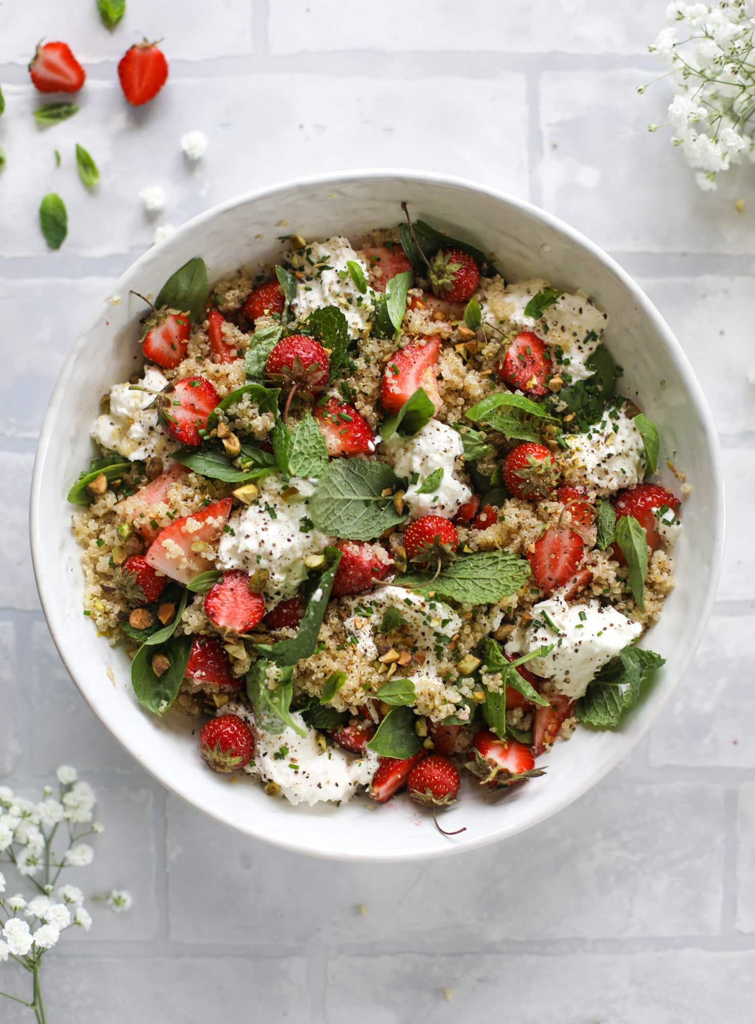 This strawberry quinoa salad is loaded with fresh herbs, burrata cheese and chopped pistachios. Topped with a lemon dressing, it's heavenly!