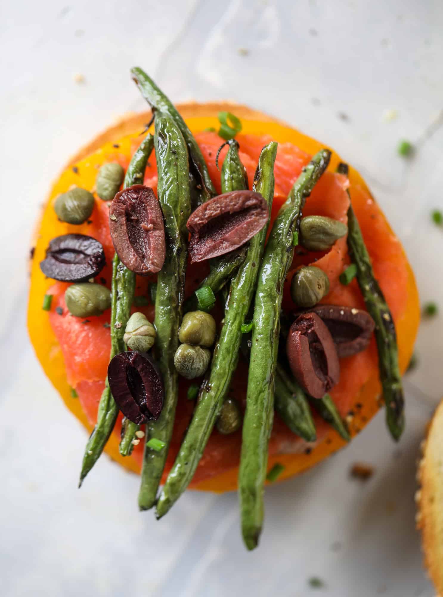 These nicoise bagels are a spin on my favorite salad! Loaded with smoked salmon, blistered green beans and tons of goodness. They are delish!