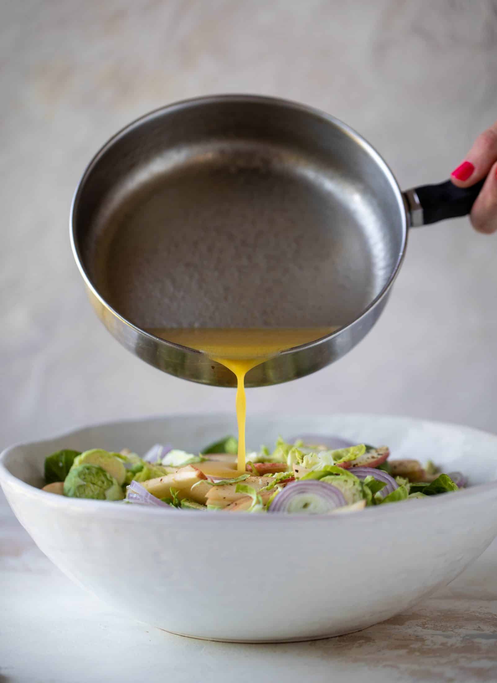 This crunchy brussels sprouts apple salad is filled with sprouts, apples, shallots, cinnamon toasted walnuts and drizzled with a brown butter dressing.