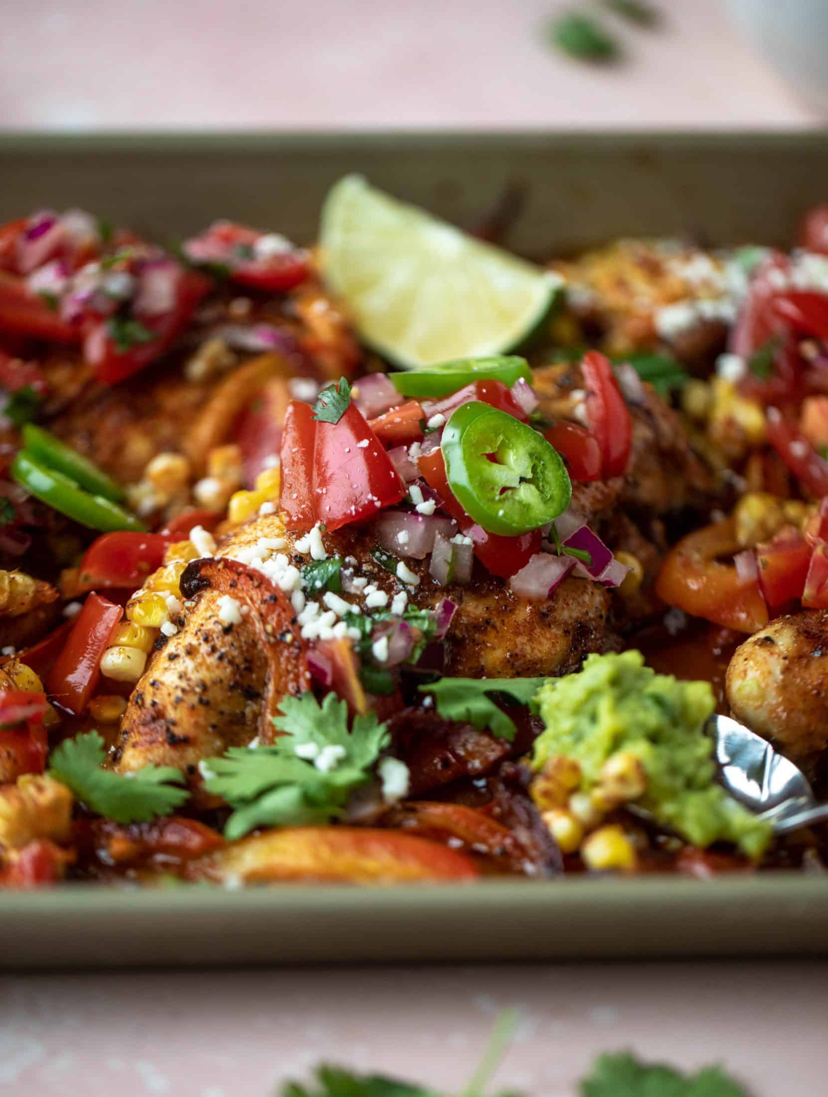 This sheet pan nacho chicken recipe results in the juiciest, more flavorful chicken that can be served in a multitude of ways!
