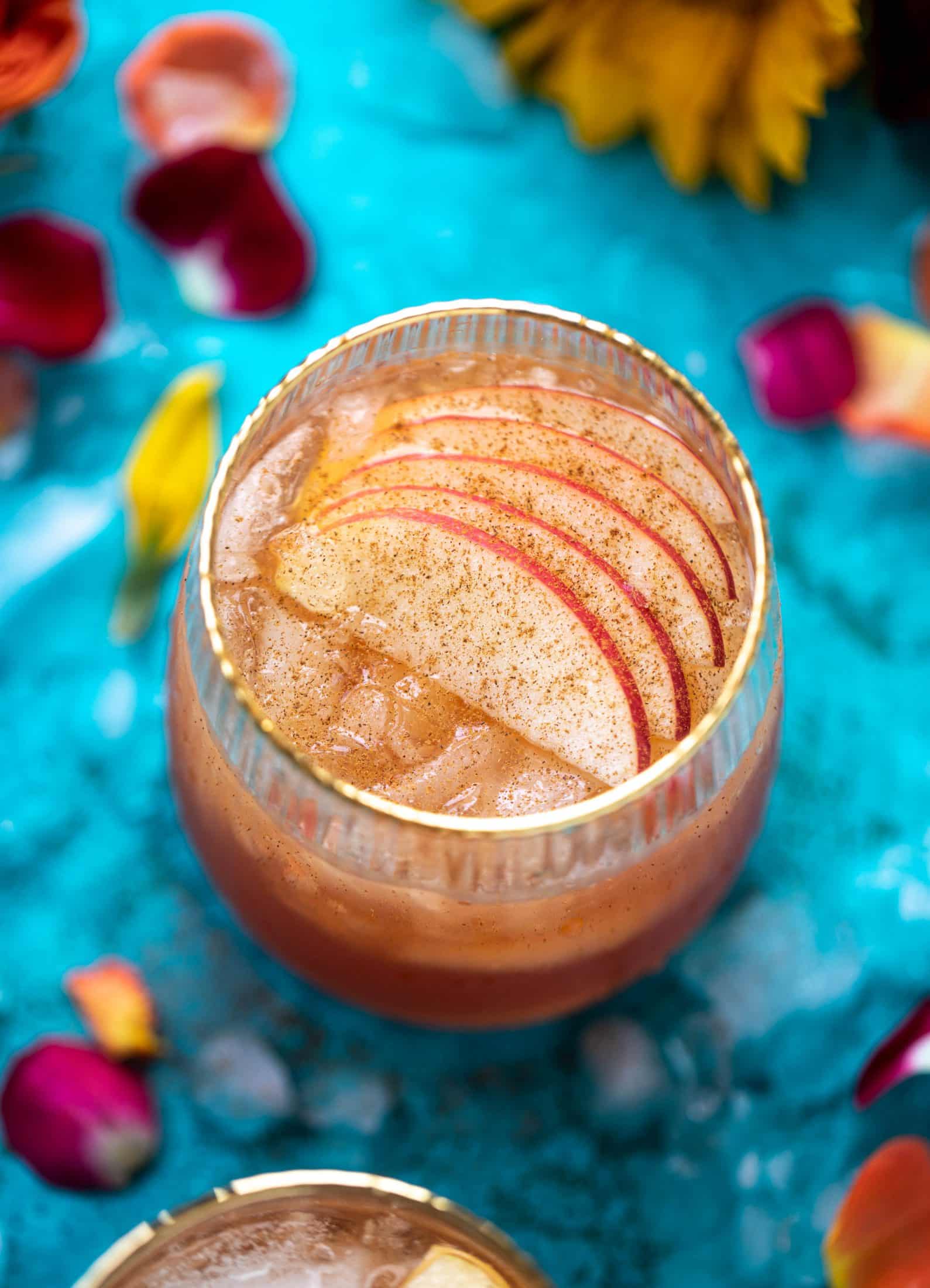This apple cider punch recipe has tons of fall flavor! Apple cider, aperol, pomegranate soda and prosecco come together to create a bubbly treat!