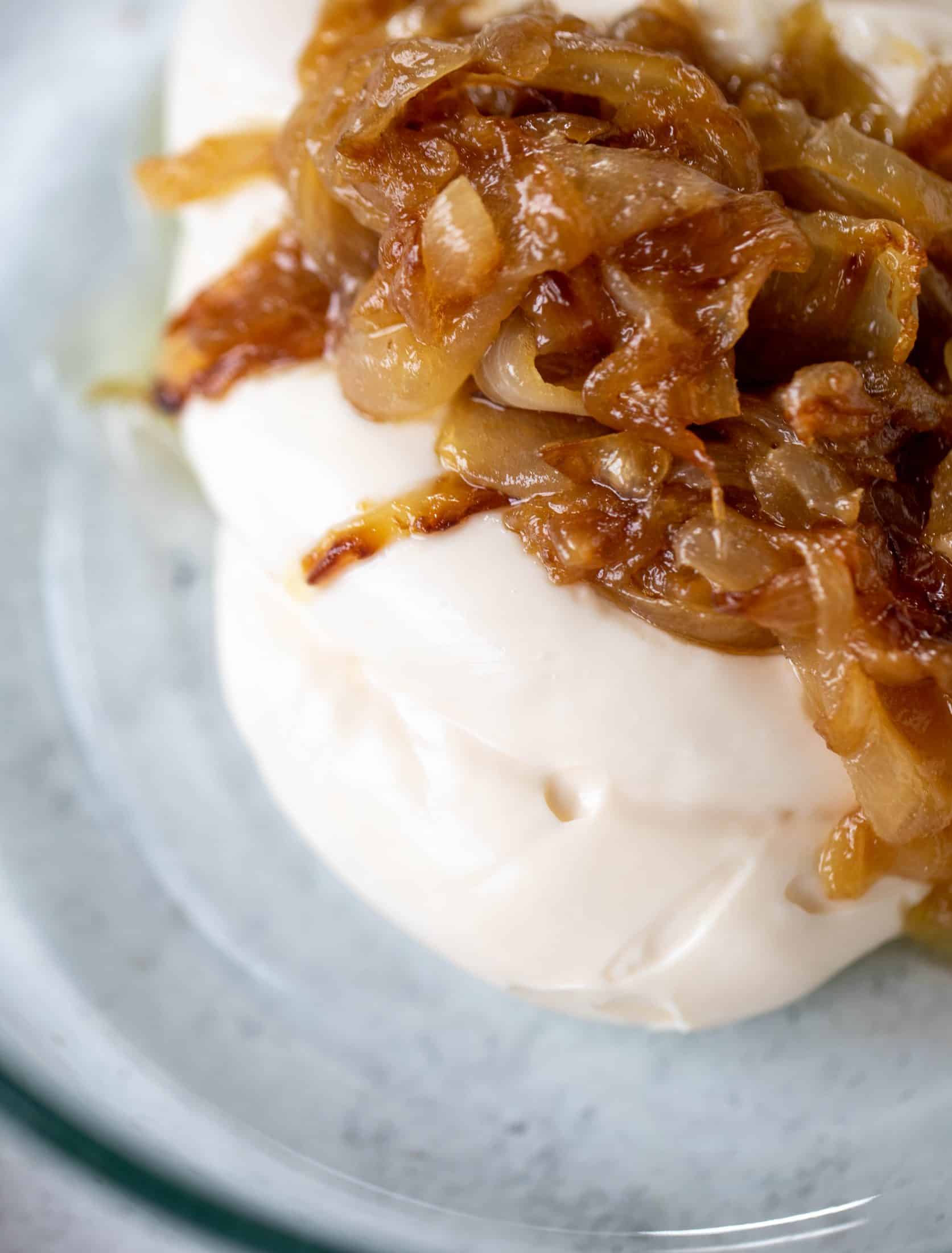 These cauliflower schnitzel sandwiches are full of flavor! Crispy cauliflower, caramelized onion mayo, pickled cabbage and microgreens. Delish!