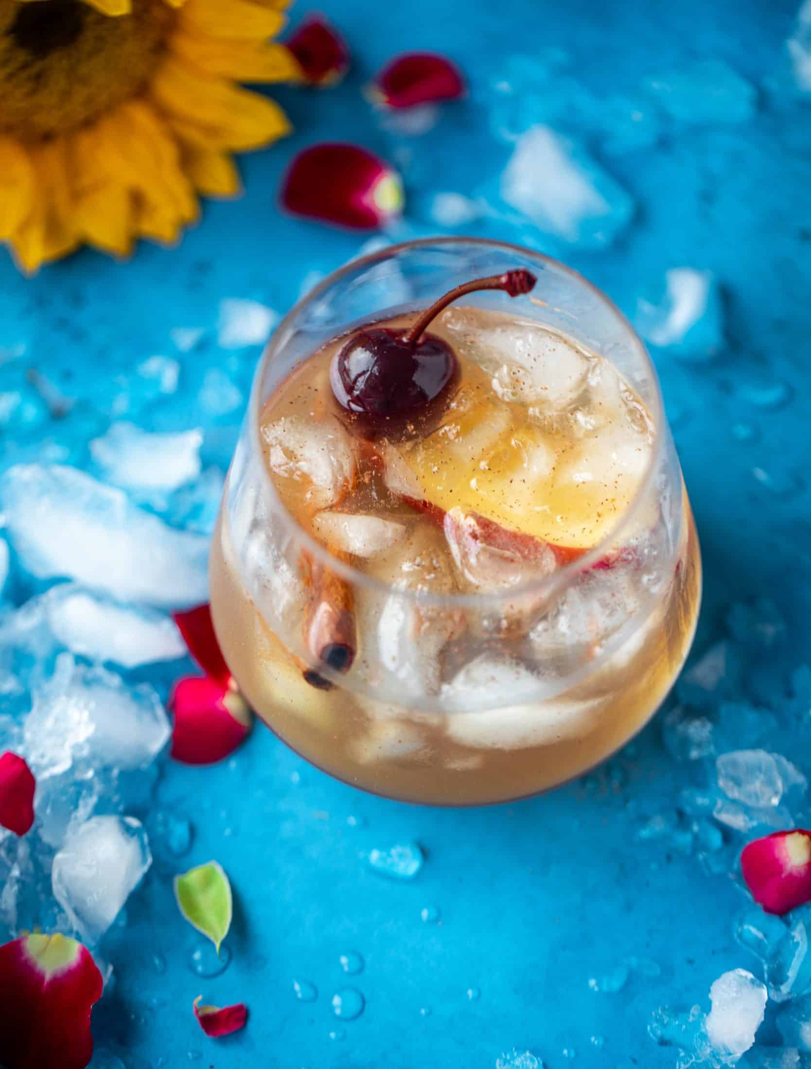 Everything I love about fall is in one little cocktail right here! If you love whiskey, this cinnamon spiced cider and splash of maple makes a sour so good!