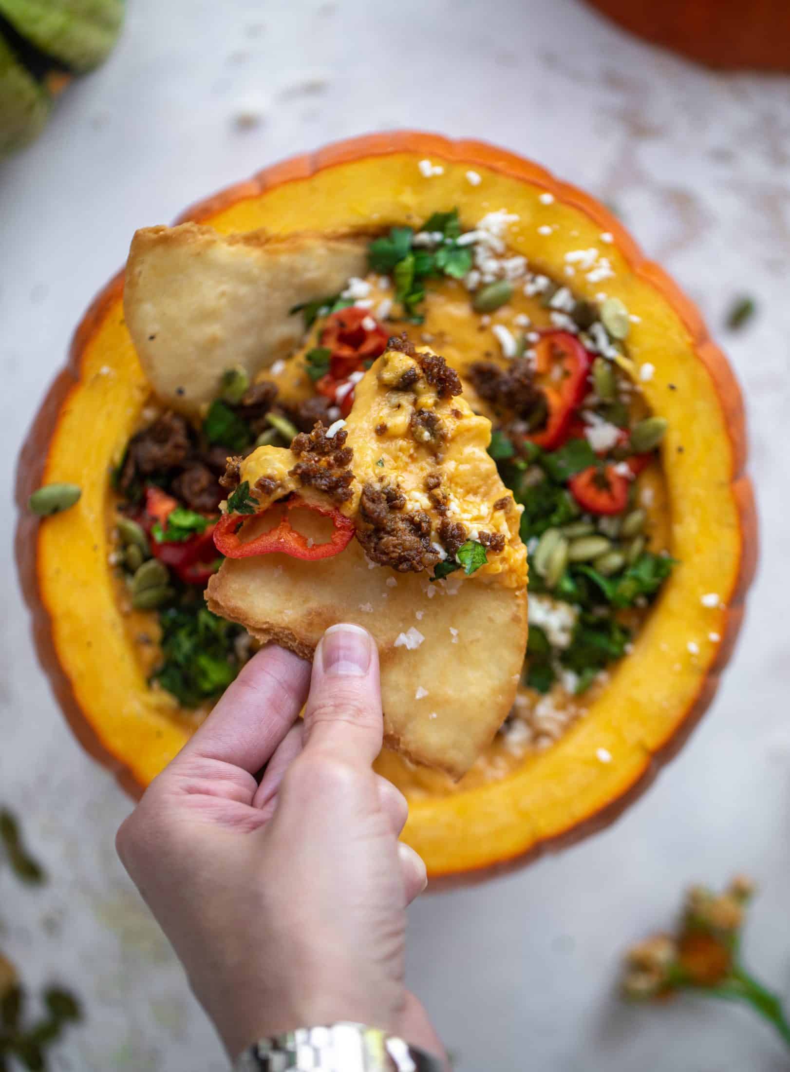 This pumpkin queso fundido is the perfect indulgence for fall. Warm pumpkin queso topped with chroizo, pepitas and jalapeños. It's delish!