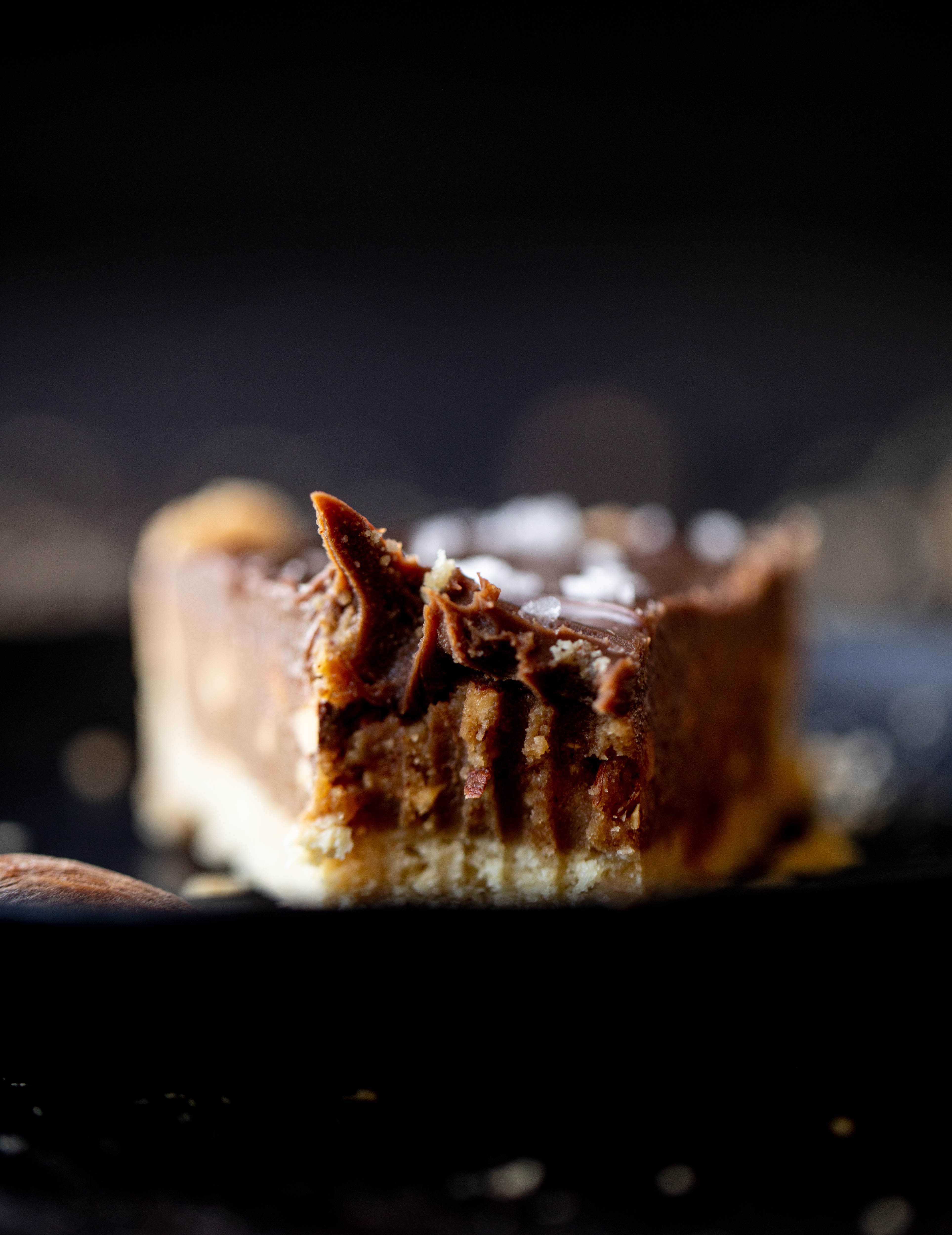 This snickers almond tart is made with an almond crust, homemade almond butter caramel and a chocolate ganache. It's to die for!