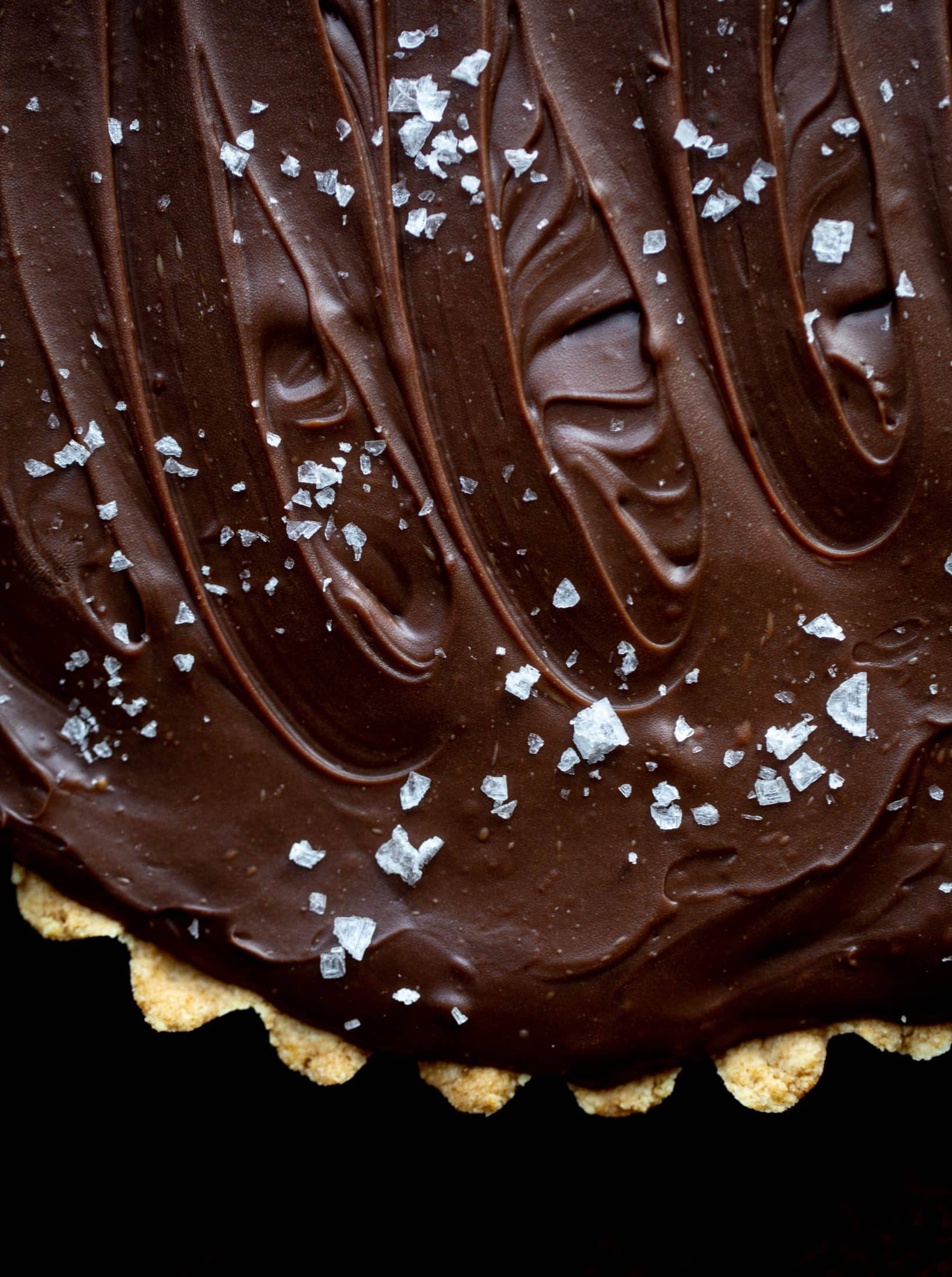 This snickers almond tart is made with an almond crust, homemade almond butter caramel and a chocolate ganache. It's to die for!