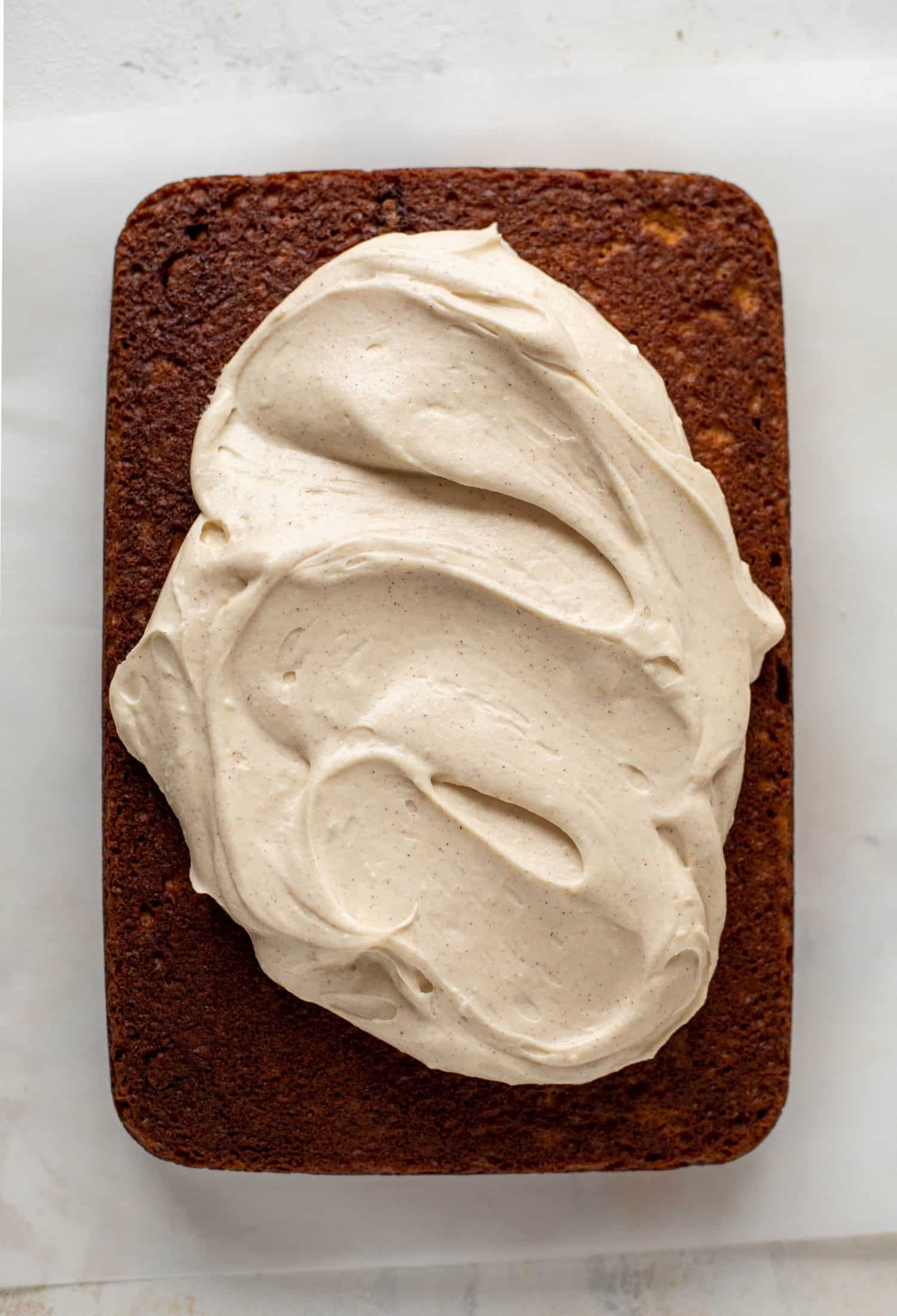 This pumpkin sheet cake is a legit pumpkin dream cake! It's so moist and fluffy and flavorful. With a blanket of cinnamon cream cheese frosting!