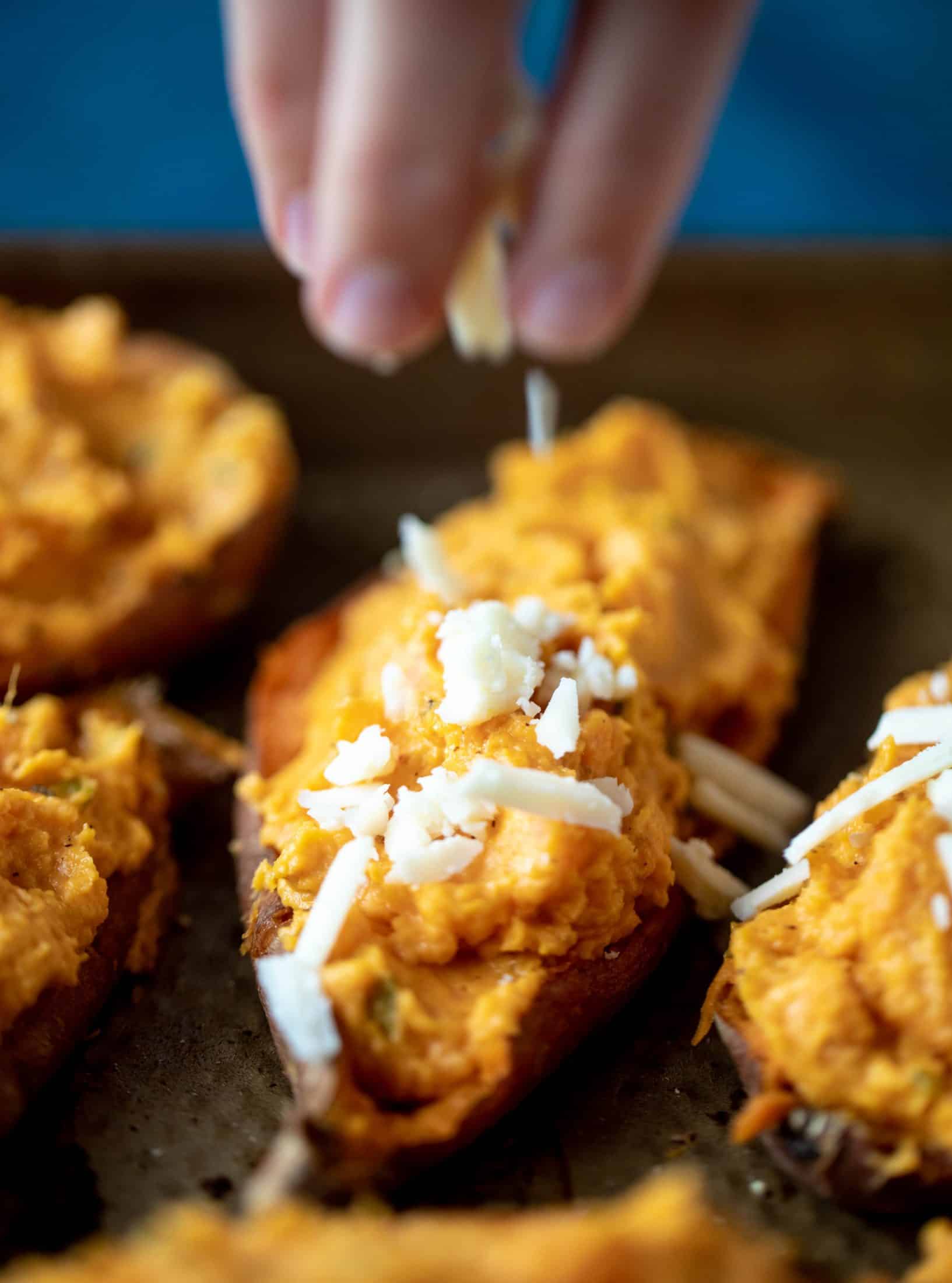 These twice baked sweet potatoes are whipped with crispy sage and pumpkin puree! Topped with cheese and baked until melty, they are super delish.