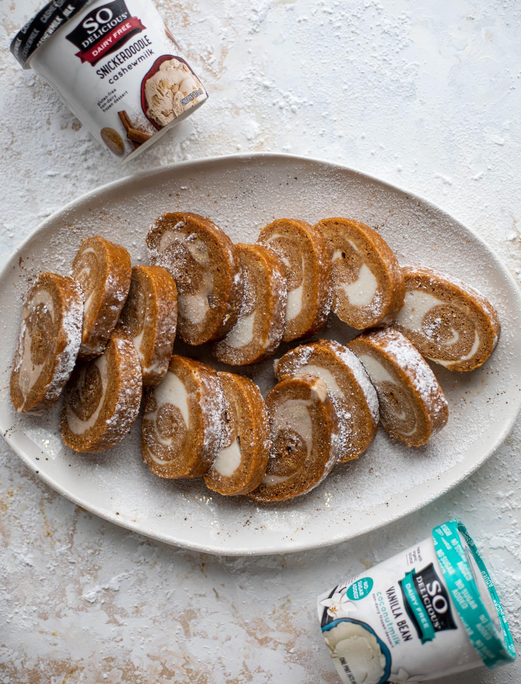 This frozen pumpkin roll is a delicious twist on the classic! Ice cream or non-dairy dessert is spread inside a classic pumpkin roll and serve frozen!
