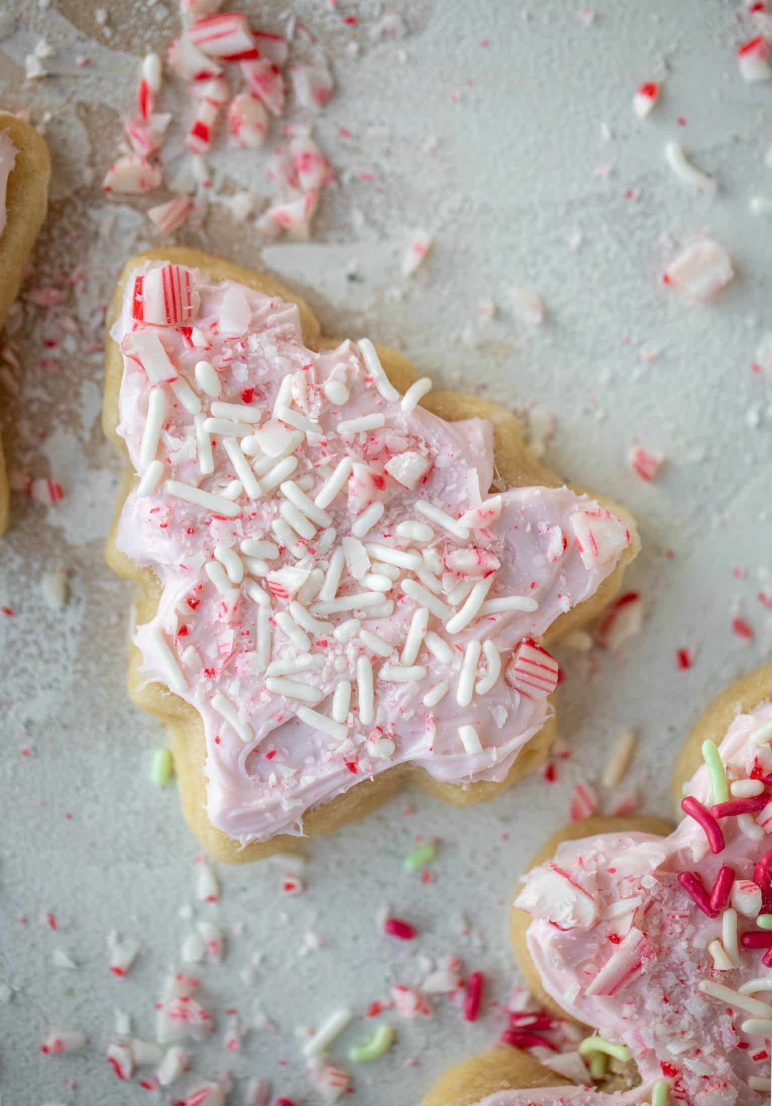 Pink peppermint sugar cookies are classic vanilla cut out cookies topped with peppermint cream cheese frosting. They are delicious!