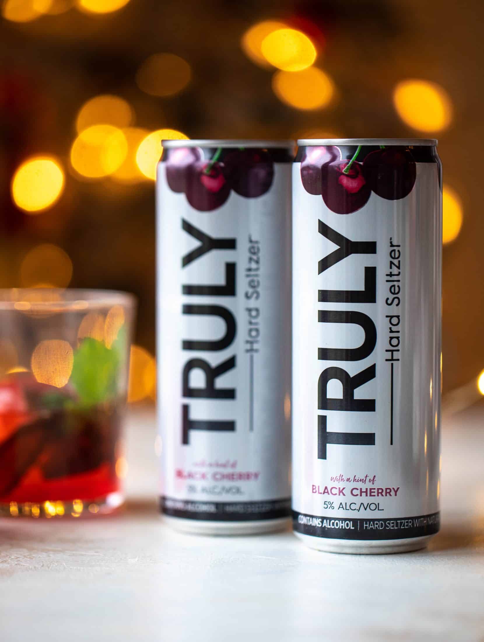 The merry cherry christmas cocktail is here! Vodka and cherries and mint, oh my! This is such a fun drink that can be made into a punch. It's delicious!