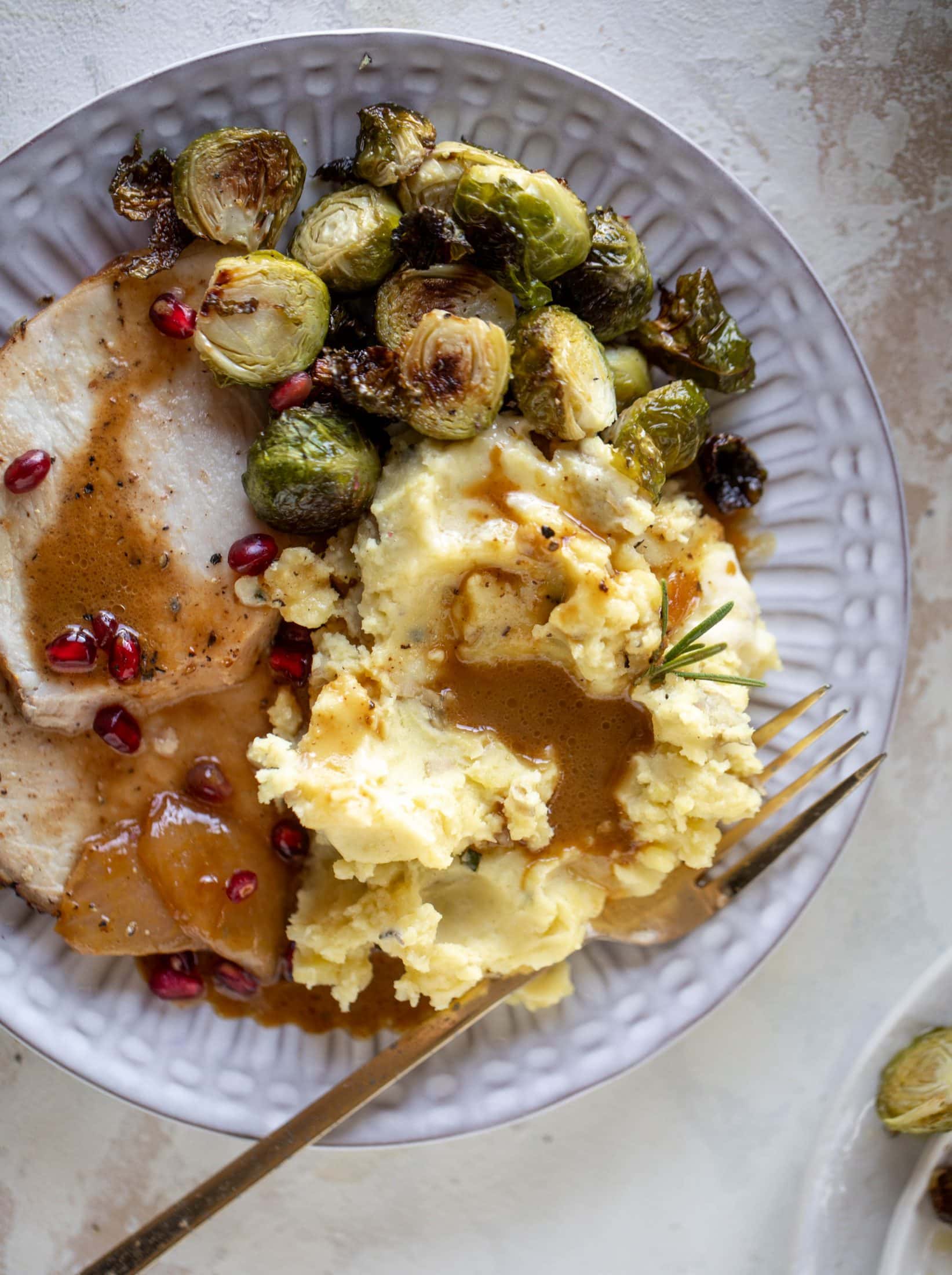 This pork loin roast is perfect for the holiday or winter season! Pomegranate and cider glazed, it's wonderful! Serve with smashed rosemary potatoes.