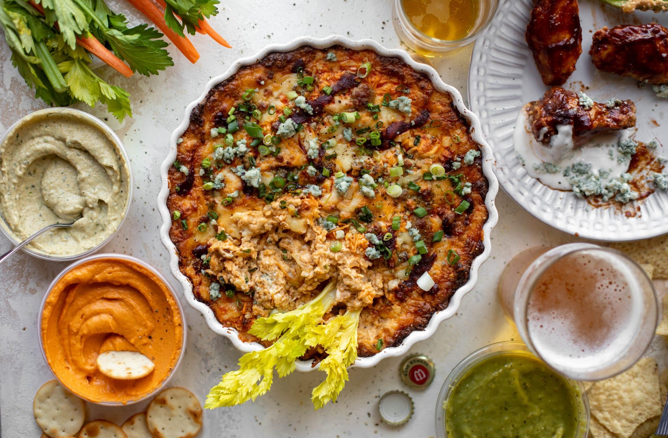 This loaded wing dip is full of buffalo wing sauce, BBQ sauce, honey mustard, ranch, blue cheese and tons of cheddar. All the flavors!