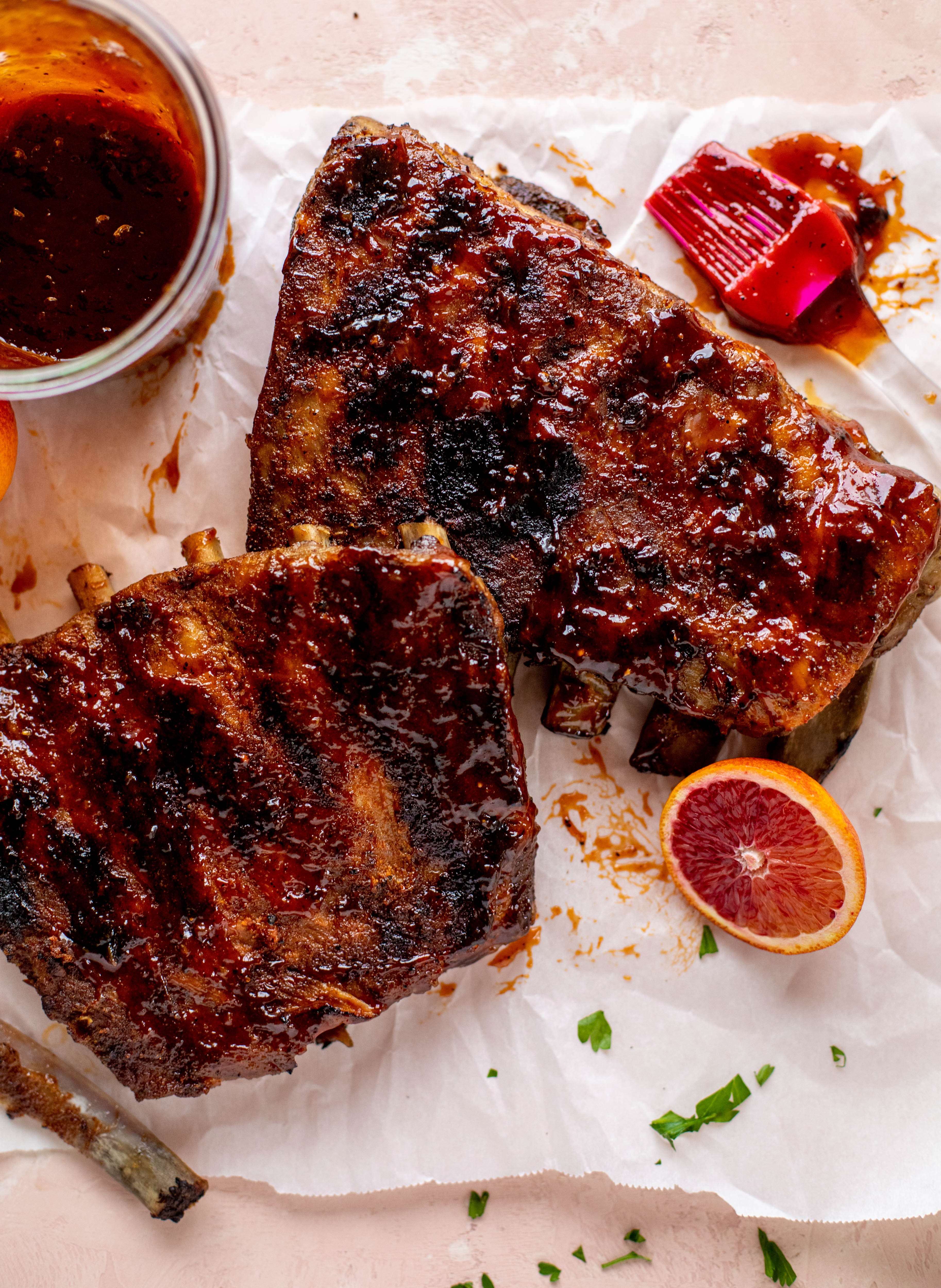 These blood orange BBQ ribs are smoky, sweet, sticky and oh-so good. Serve alongside an avocado butter greens salad for the ultimate combo!