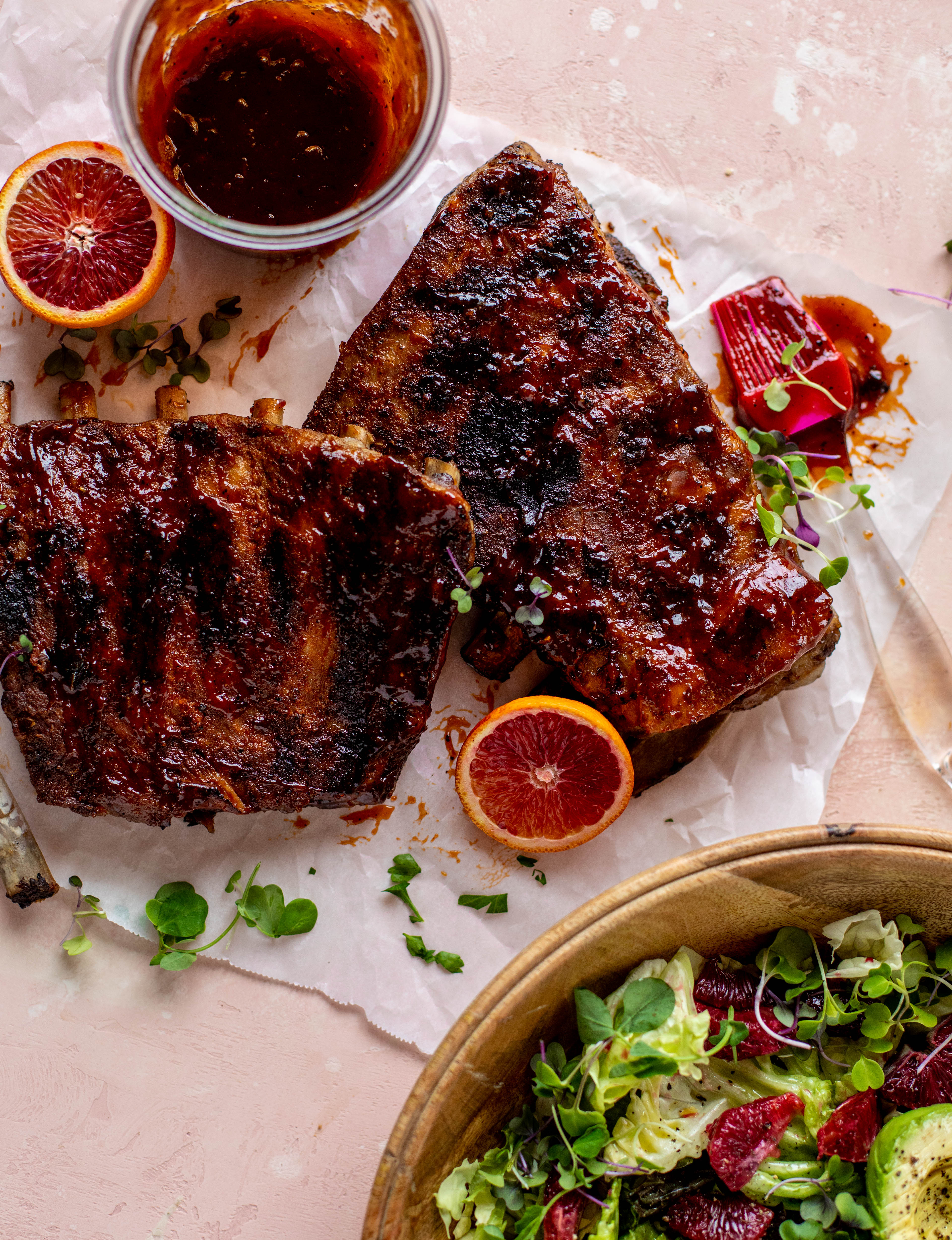 These blood orange BBQ ribs are smoky, sweet, sticky and oh-so good. Serve alongside an avocado butter greens salad for the ultimate combo!