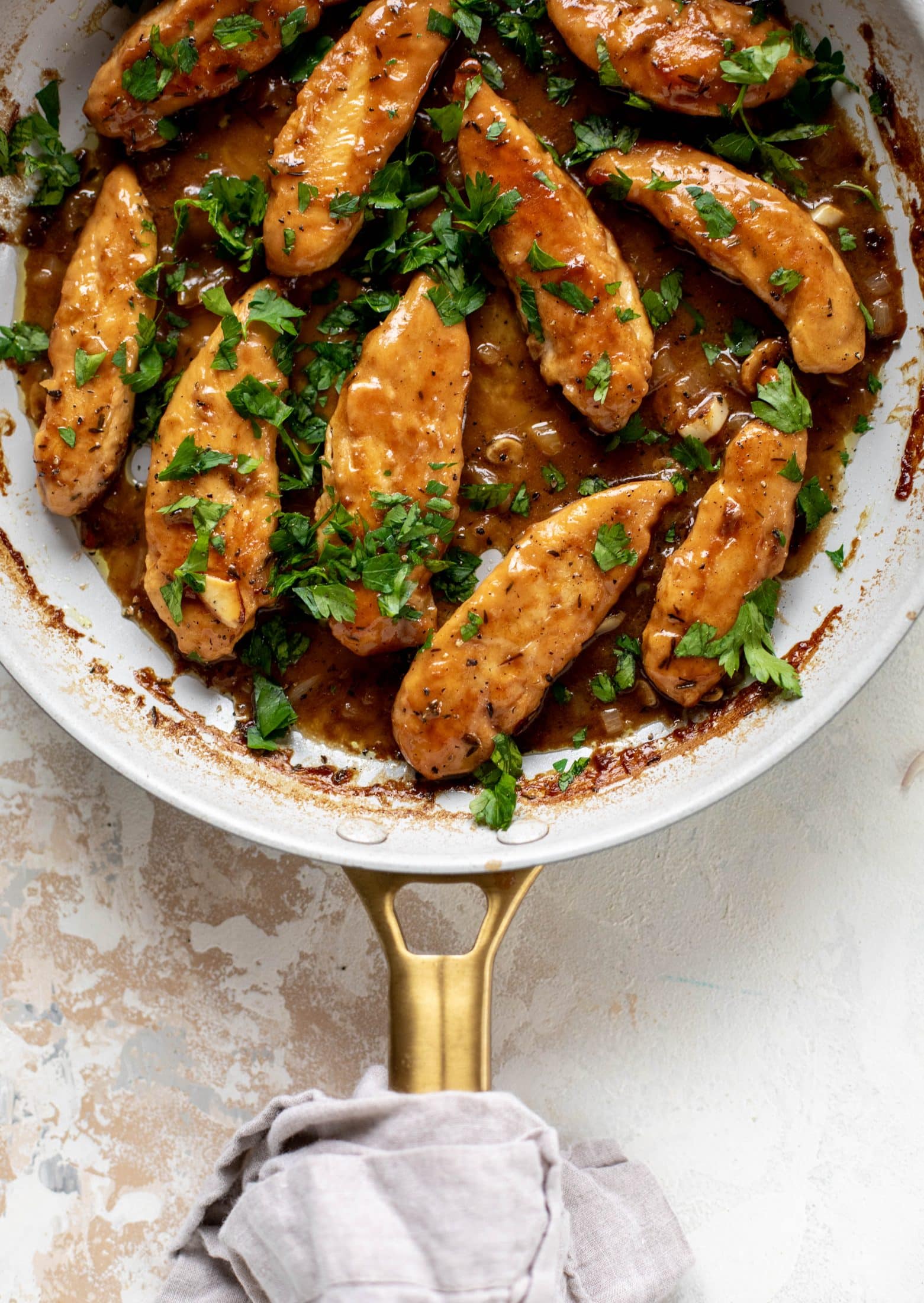 My mom's chicken marsala is easy and ridiculously flavorful! It's made without mushrooms and served alongside almond brown butter green beans.
