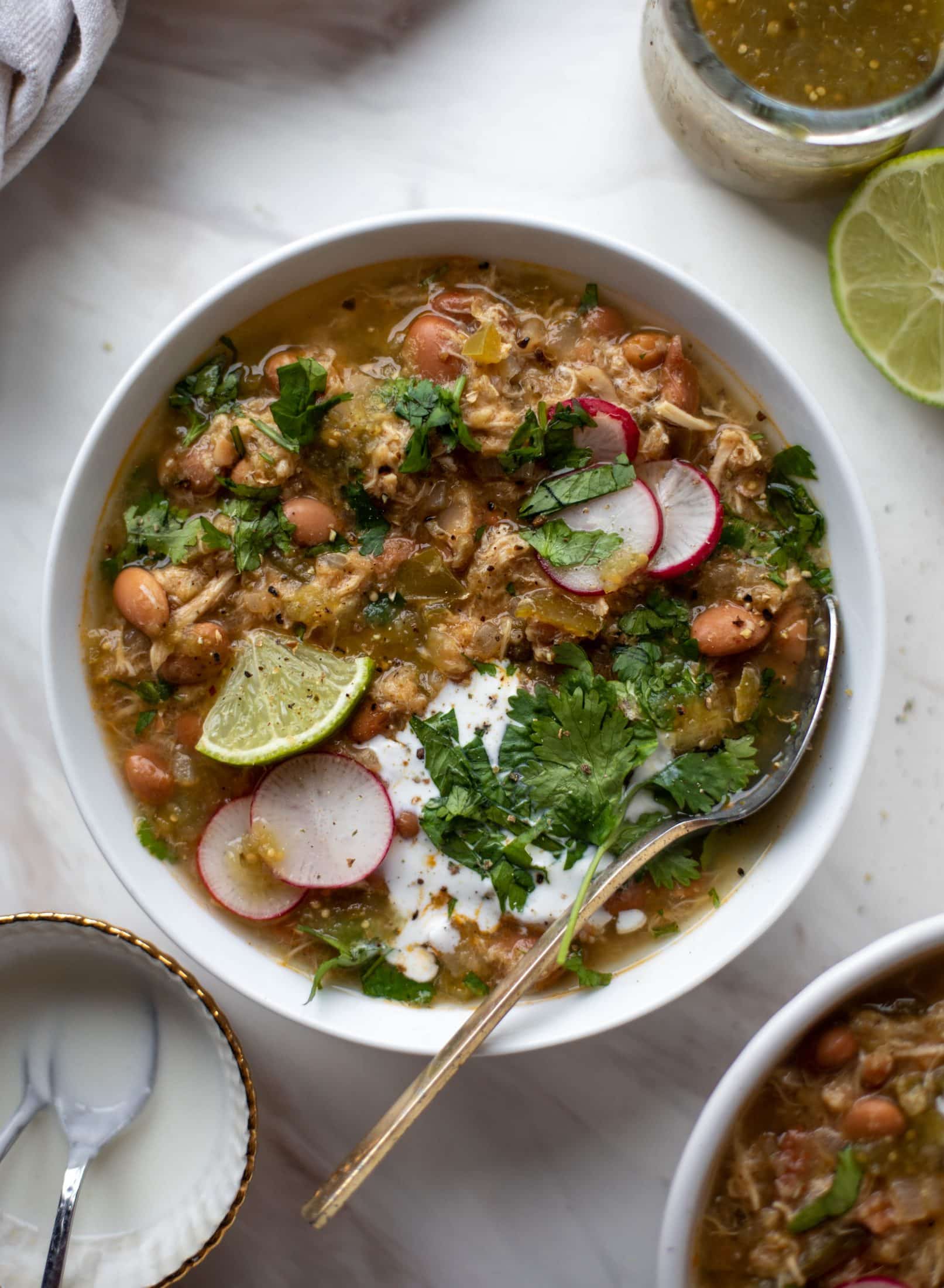 This chicken verde soup is easy to make and comes together quickly. It's served with salted yogurt dolloped on top and it's delish!
