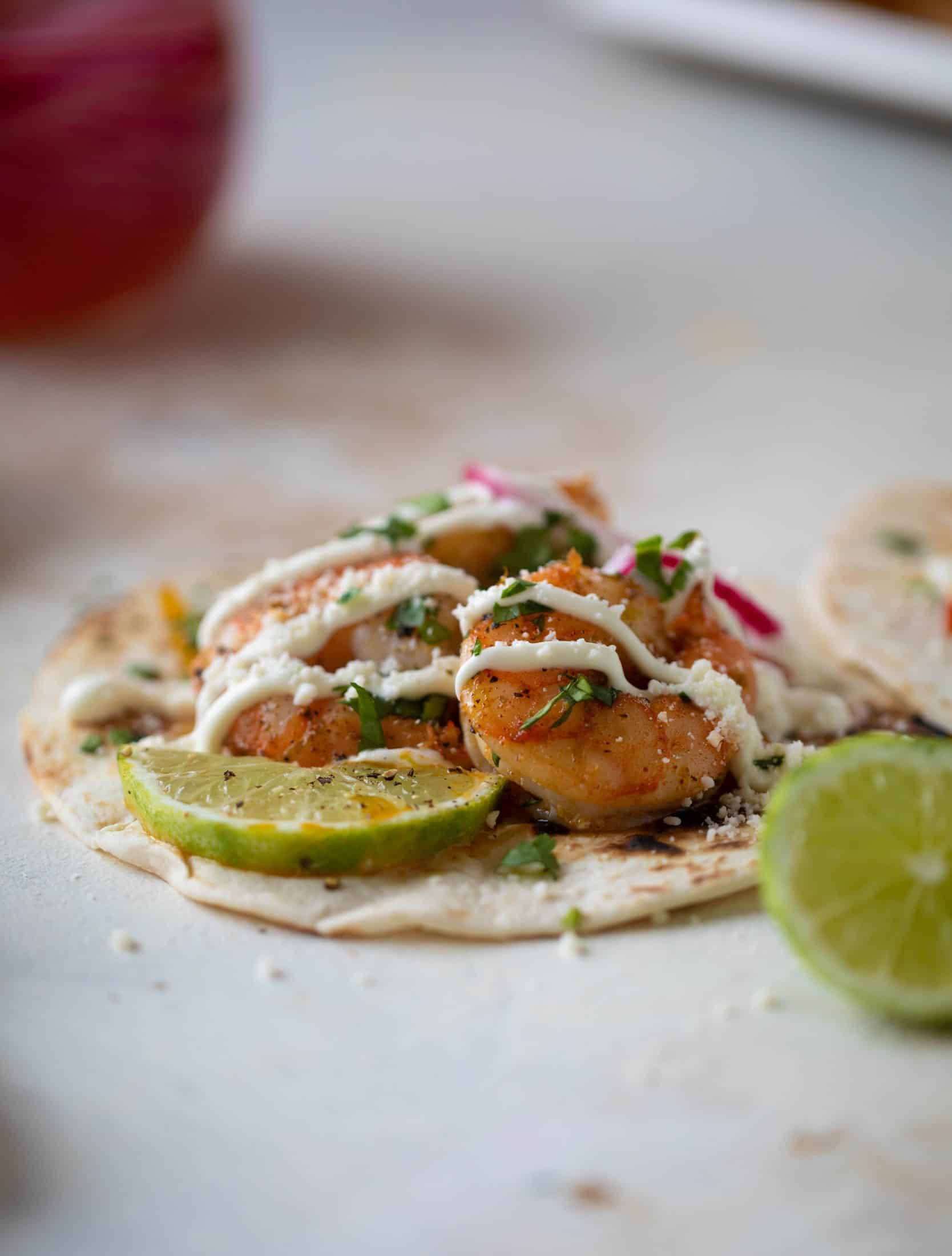 These lime sheet pan shrimp fajitas are the best weeknight meal! Make everything on the sheet pan and serve in warm tortillas. Delicious!