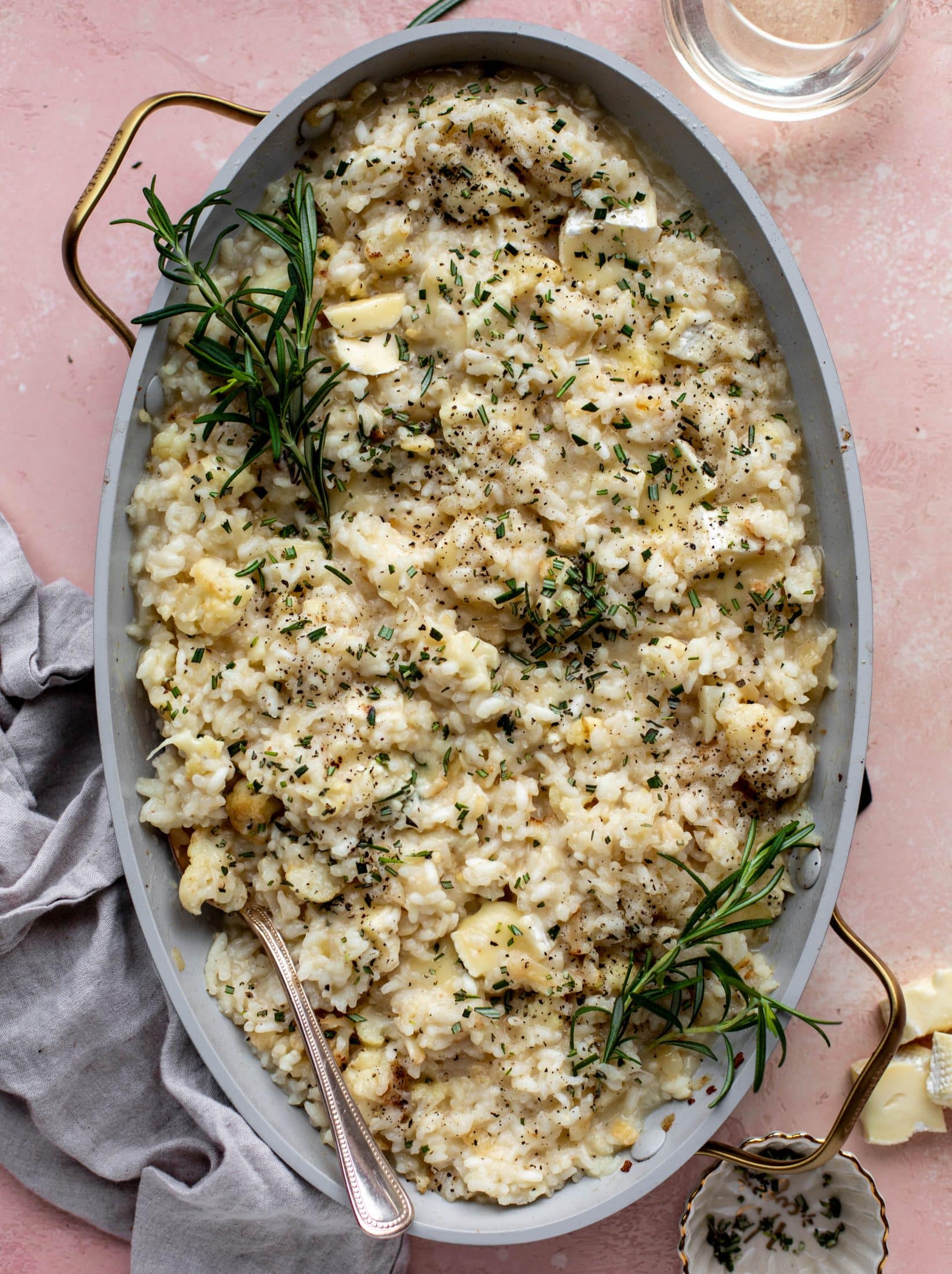 This baked risotto is delicious and so much easier than the stovetop version! Toasted cauliflower, brie cheese and rosemary make this taste incredible.
