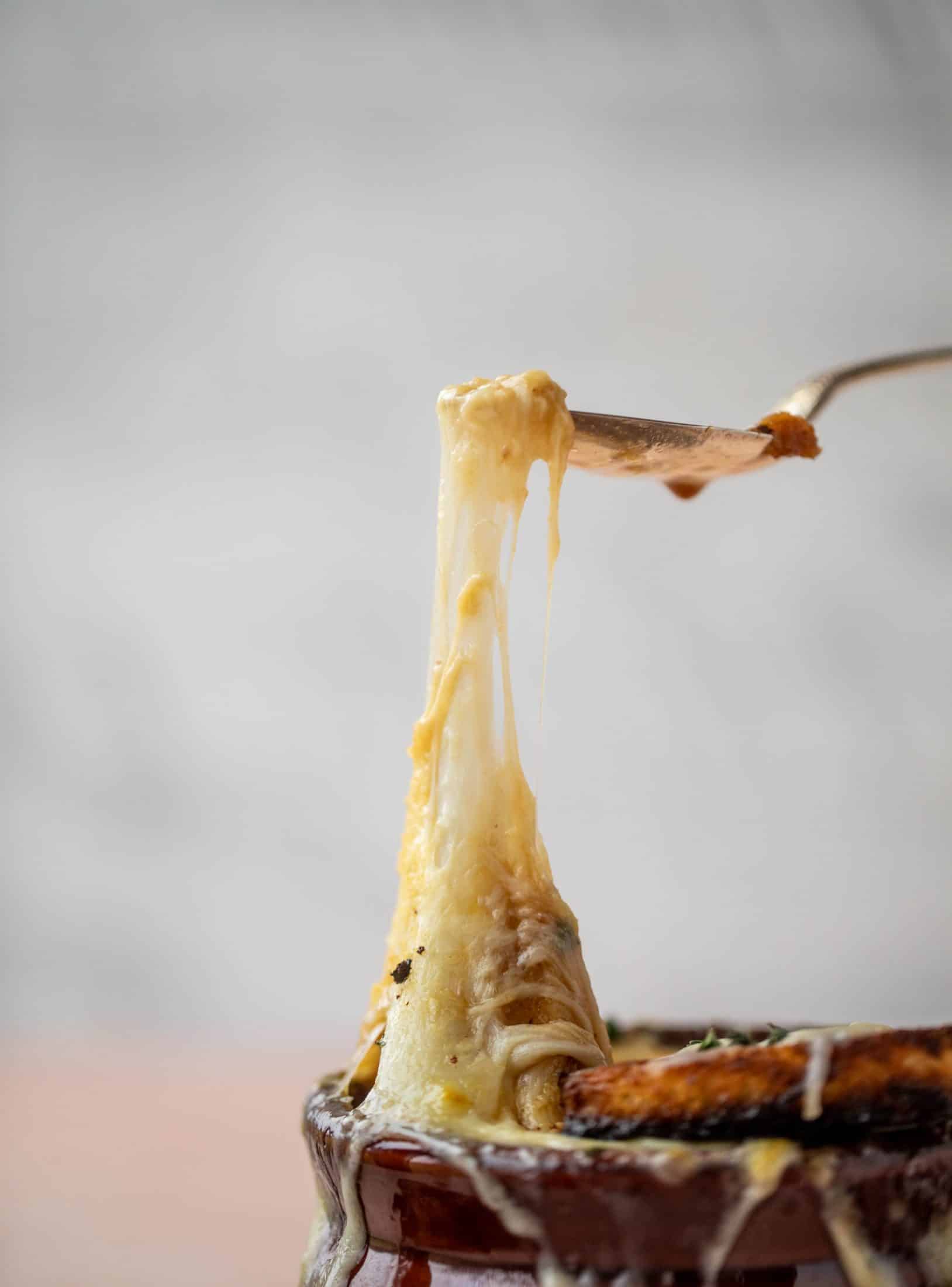 My favorite french onion soup starts with bourbon caramelized onions! Adorable heart croutons and tons of gruyere take it over the top.