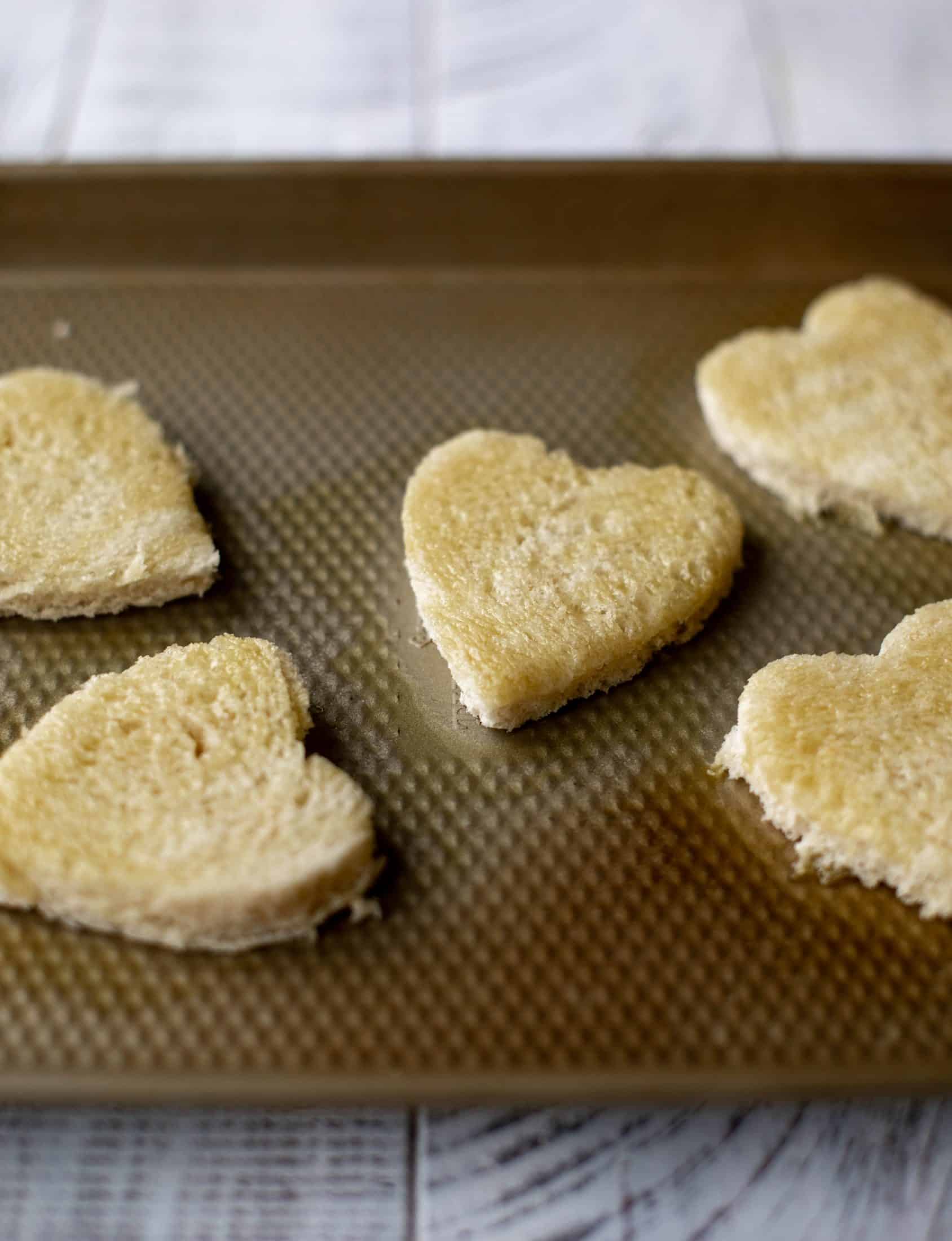 My favorite french onion soup starts with bourbon caramelized onions! Adorable heart croutons and tons of gruyere take it over the top.