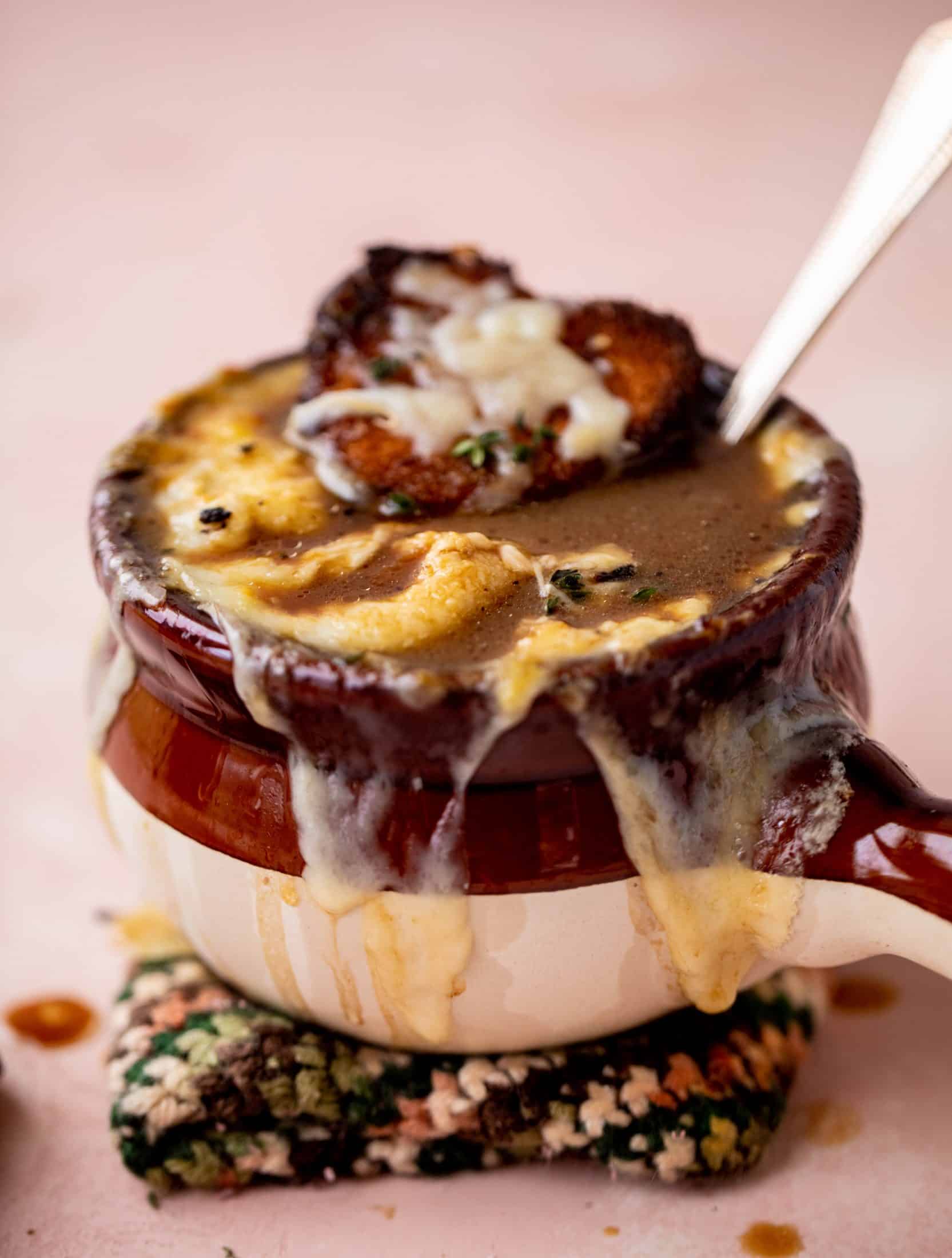 My favorite french onion soup starts with bourbon caramelized onions! Adorable heart croutons and tons of gruyere take it over the top.