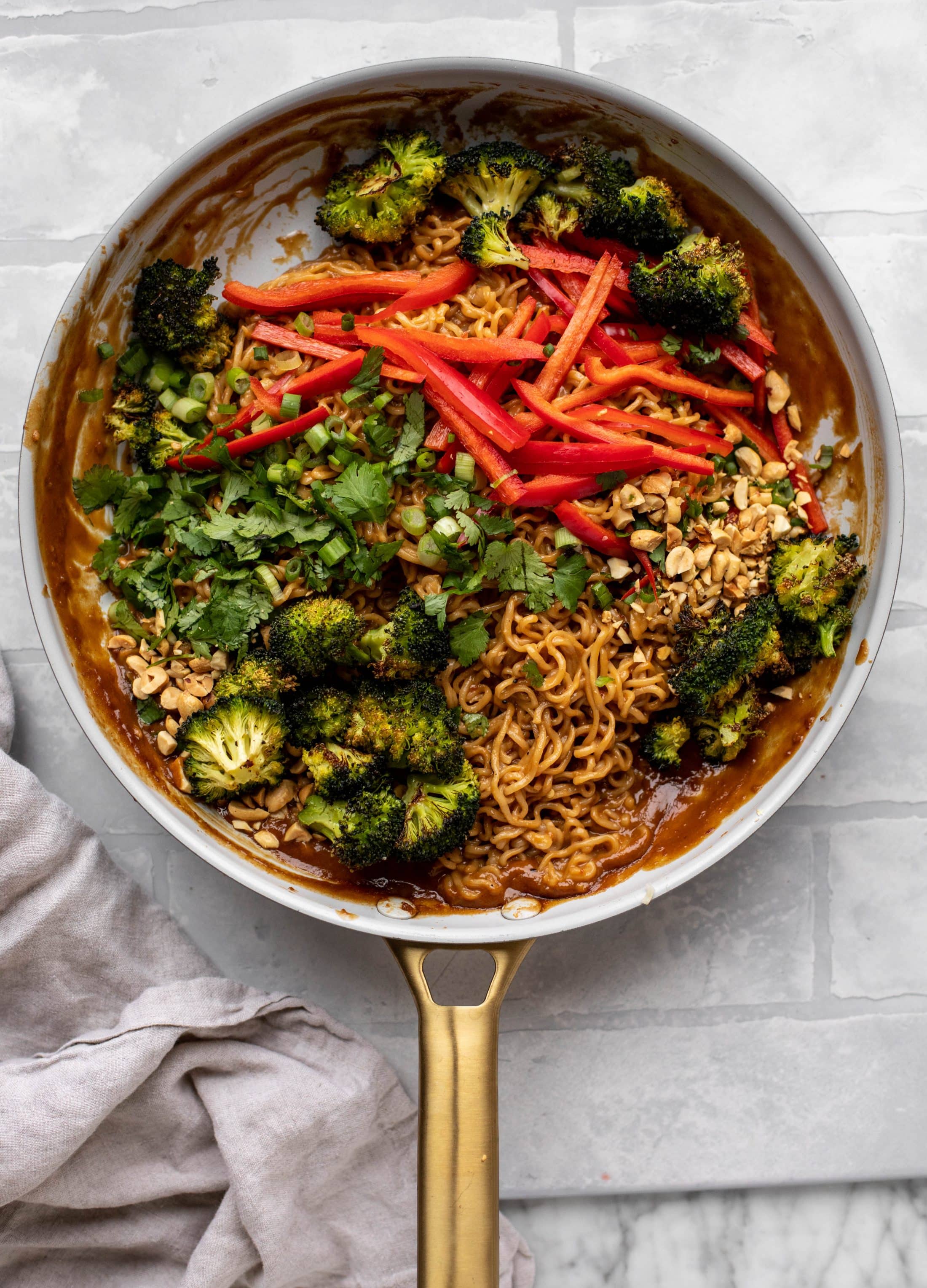 These are the most delicious peanut noodles! Tossed with roasted broccoli, red peppers, scallions, peanuts and an incredibly flavorful sauce!