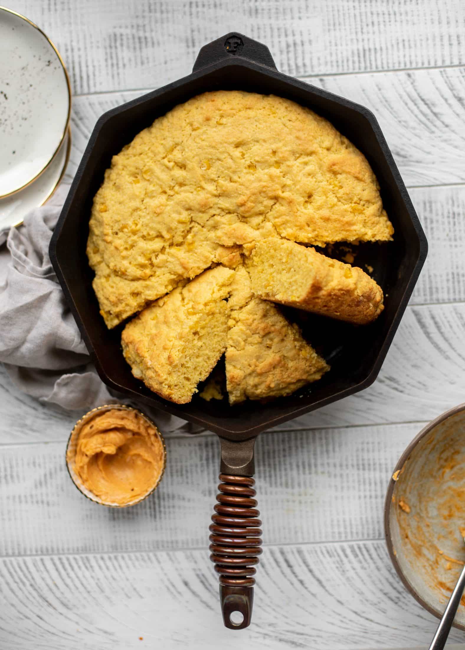 This skillet cornbread is so fluffy and delicious! Serve it hot from the oven with chipotle honey butter. It makes a great appetizer or side dish.
