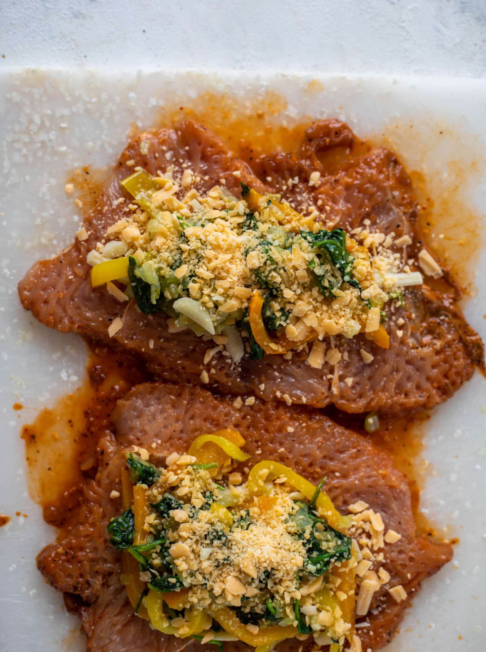 These southwest stuffed turkey tenderloins are so flavorful and filled with spinach, peppers, onions and cheddar! Serve alongside a lime black bean salad.