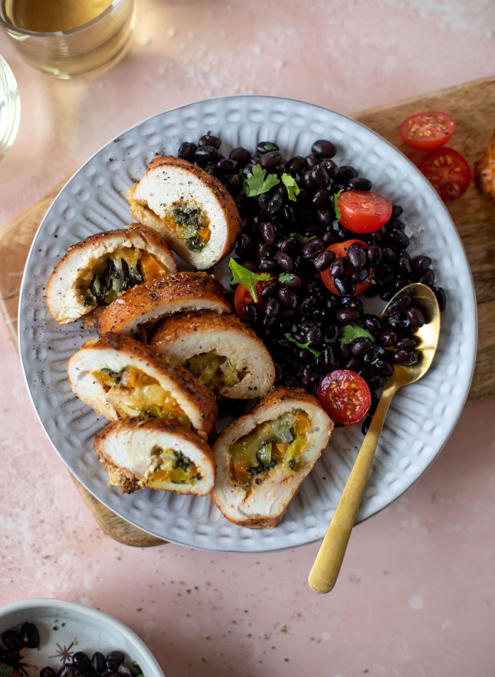 These southwest stuffed turkey tenderloins are so flavorful and filled with spinach, peppers, onions and cheddar! Serve alongside a lime black bean salad.