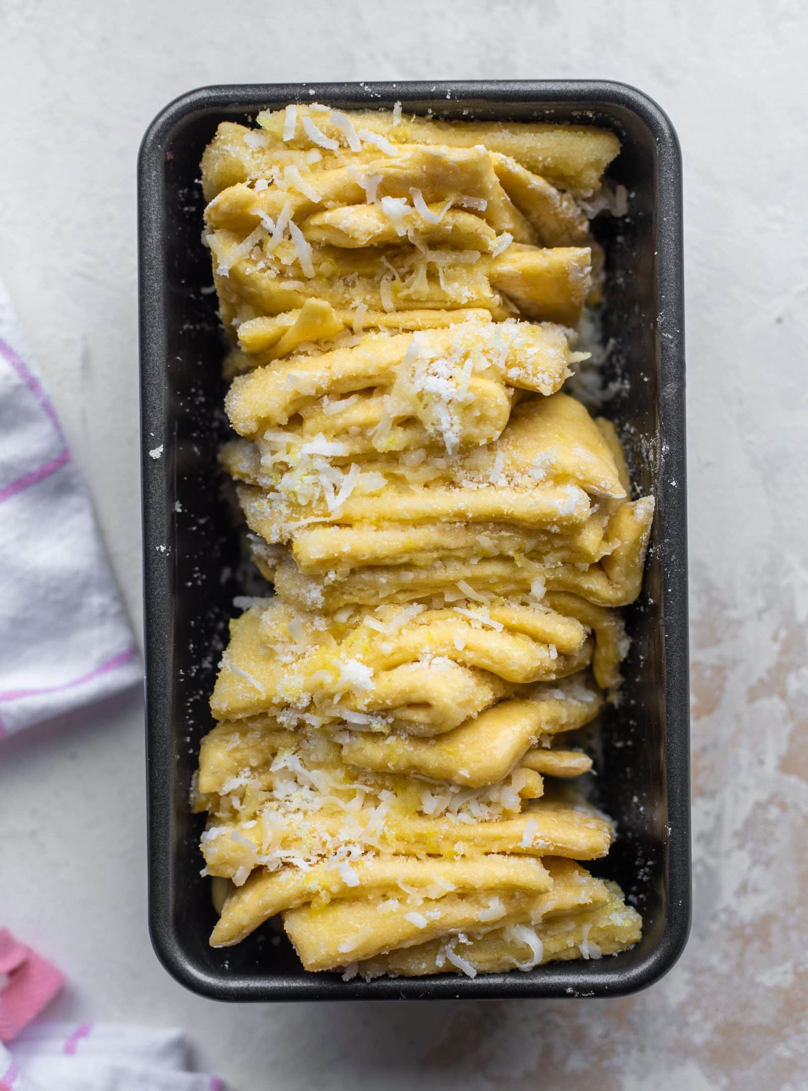 This lemon coconut bread is a pull apart dream! It's perfect for brunch or dessert with the perfect amount of fluffiness.