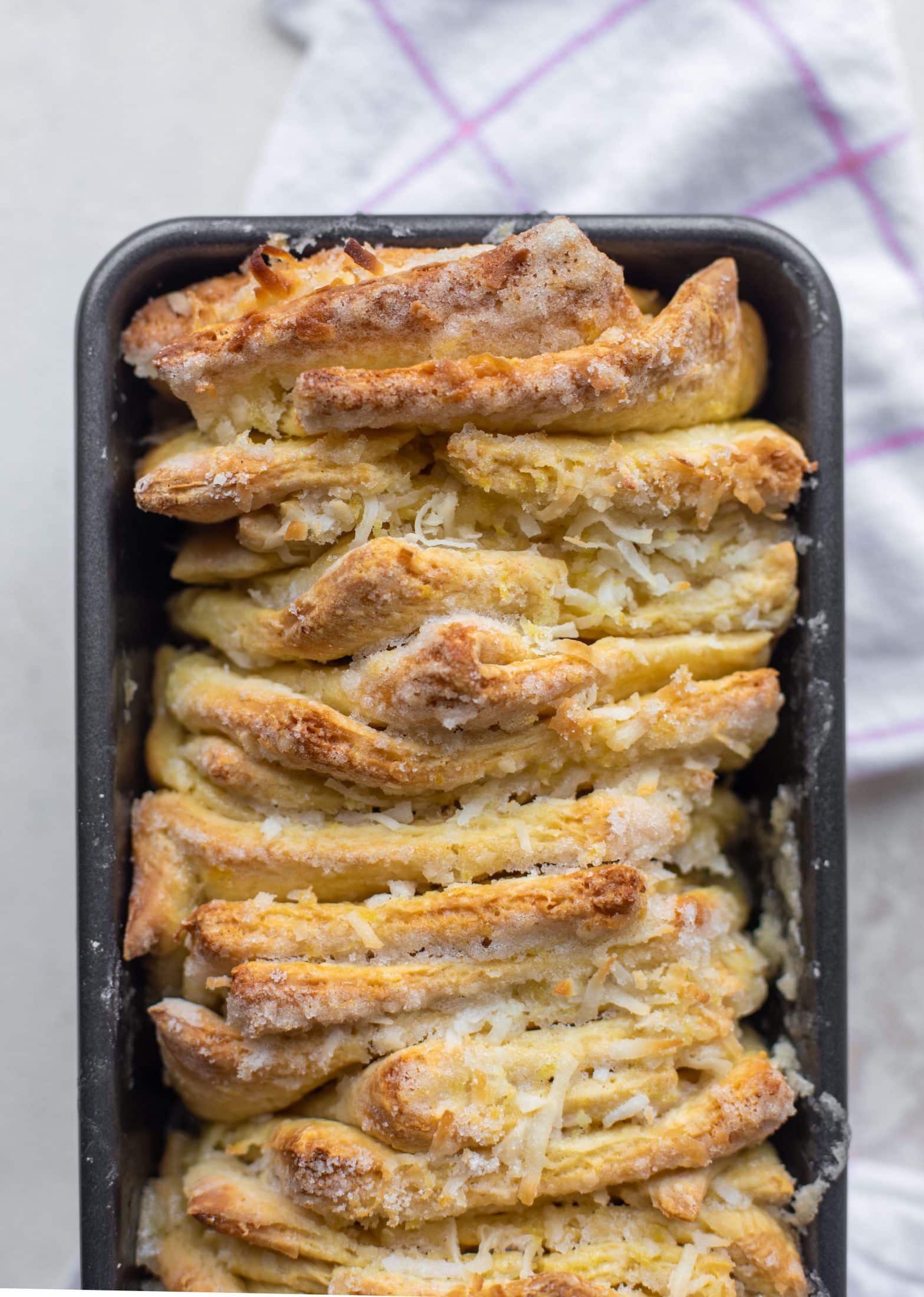 This lemon coconut bread is a pull apart dream! It's perfect for brunch or dessert with the perfect amount of fluffiness.