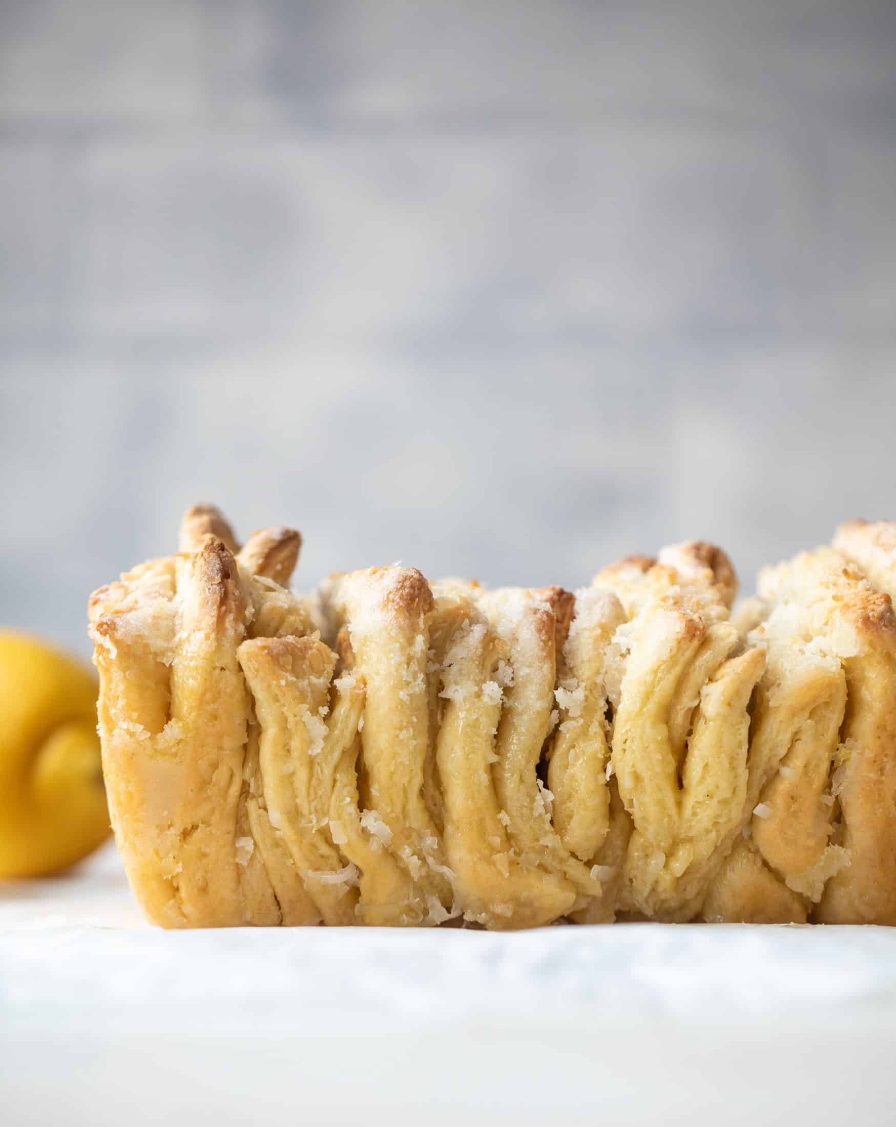 This lemon coconut bread is a pull apart dream! It's perfect for brunch or dessert with the perfect amount of fluffiness.