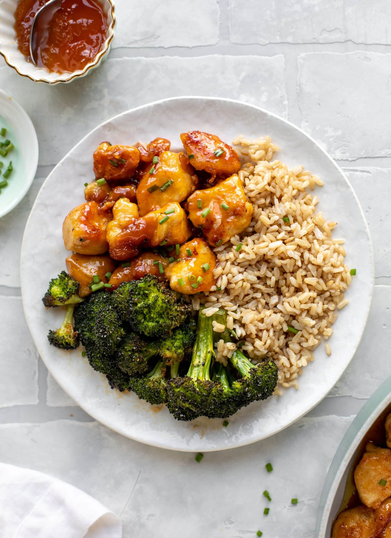 This sticky apricot chicken is so juicy and delicious! The chicken is seared and glazed with a jammy apricot sauce. Serve with broccoli and rice!
