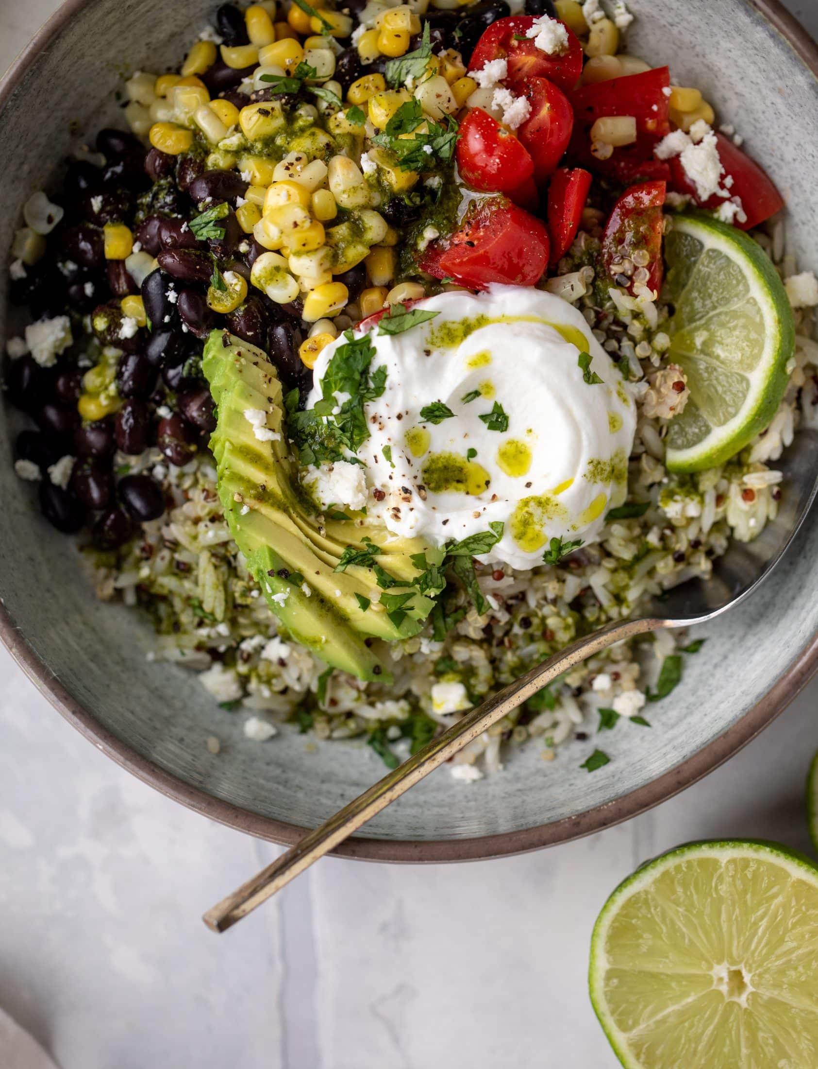 These baja grain bowls are a delicious copycat of the Panera baja grain bowls! Rice, quinoa, beans, tomatoes and cilantro lime vinaigrette!